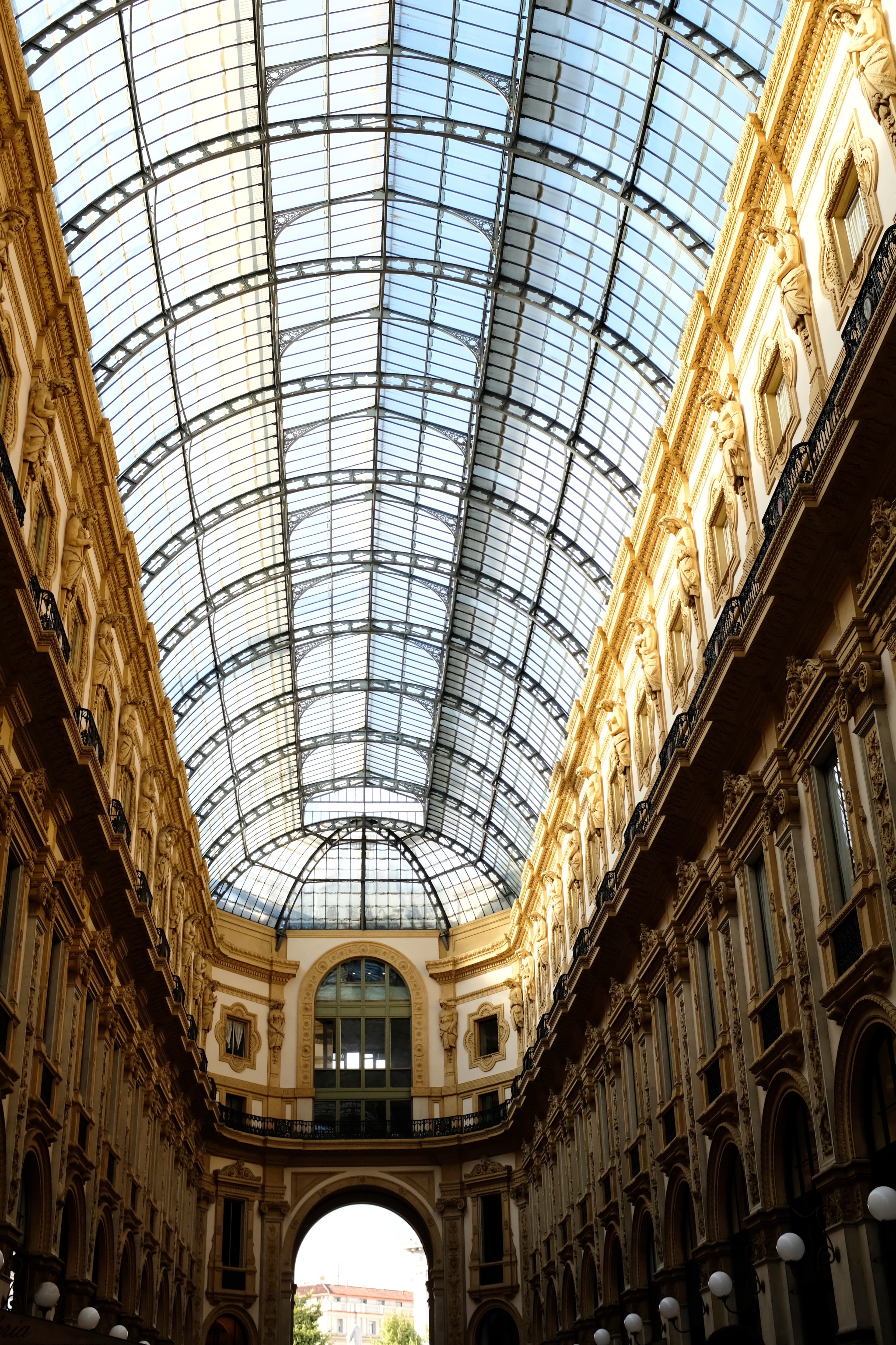 An arched skylight illuminating the historic building interior on a sunny day.