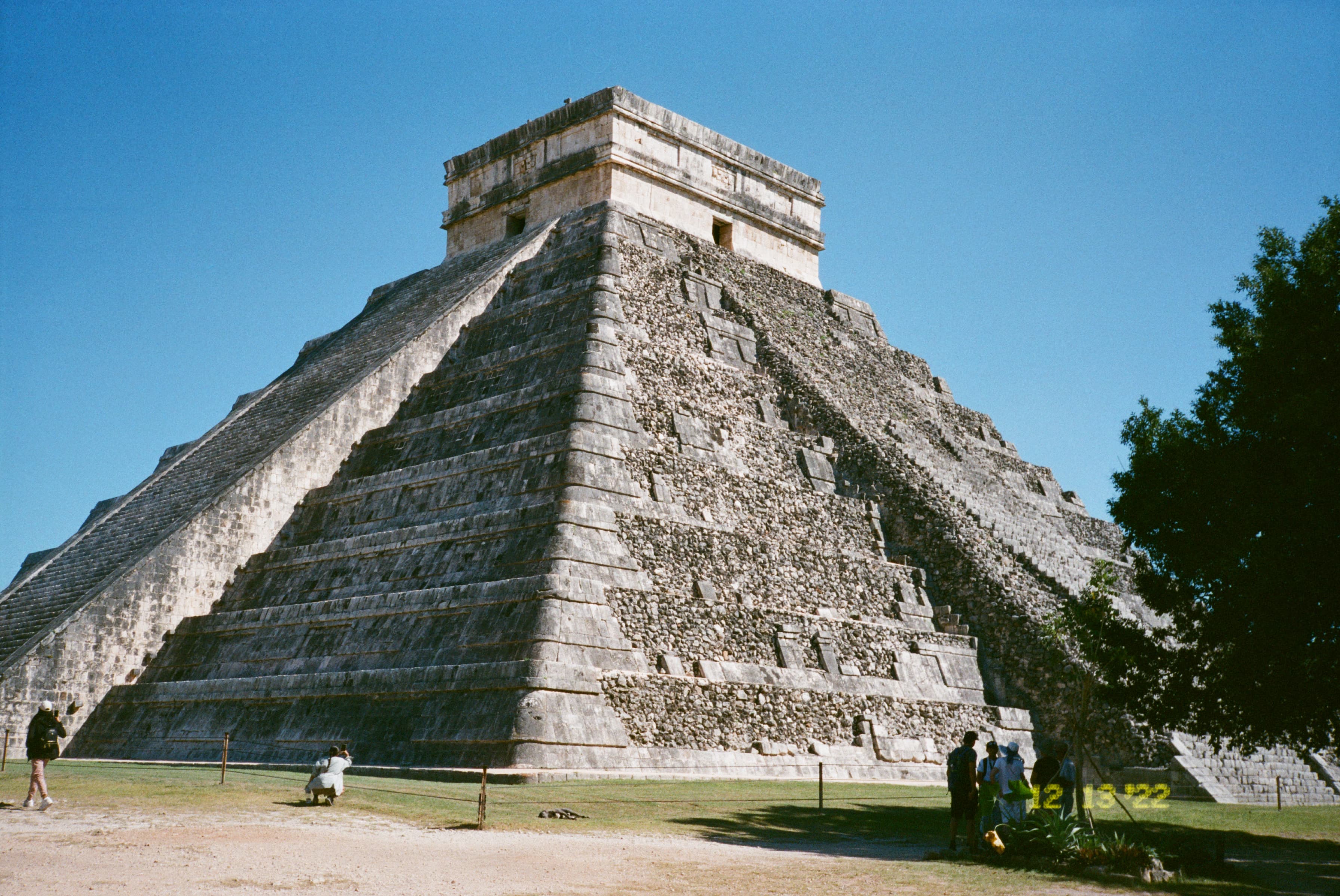 View of an ancient stone pyramid on a sunny day in Mexico
