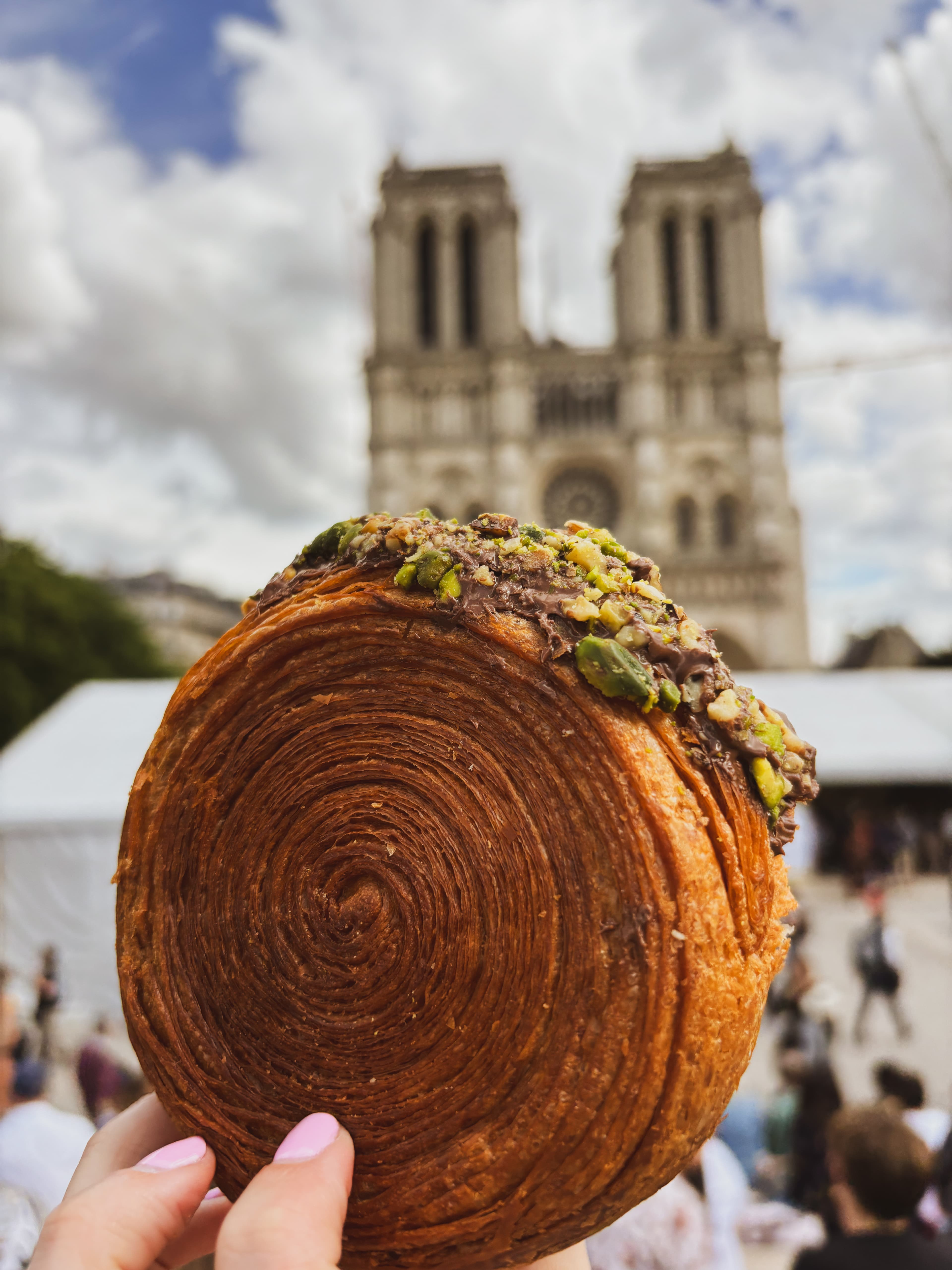 A pastry with a city in the distance.