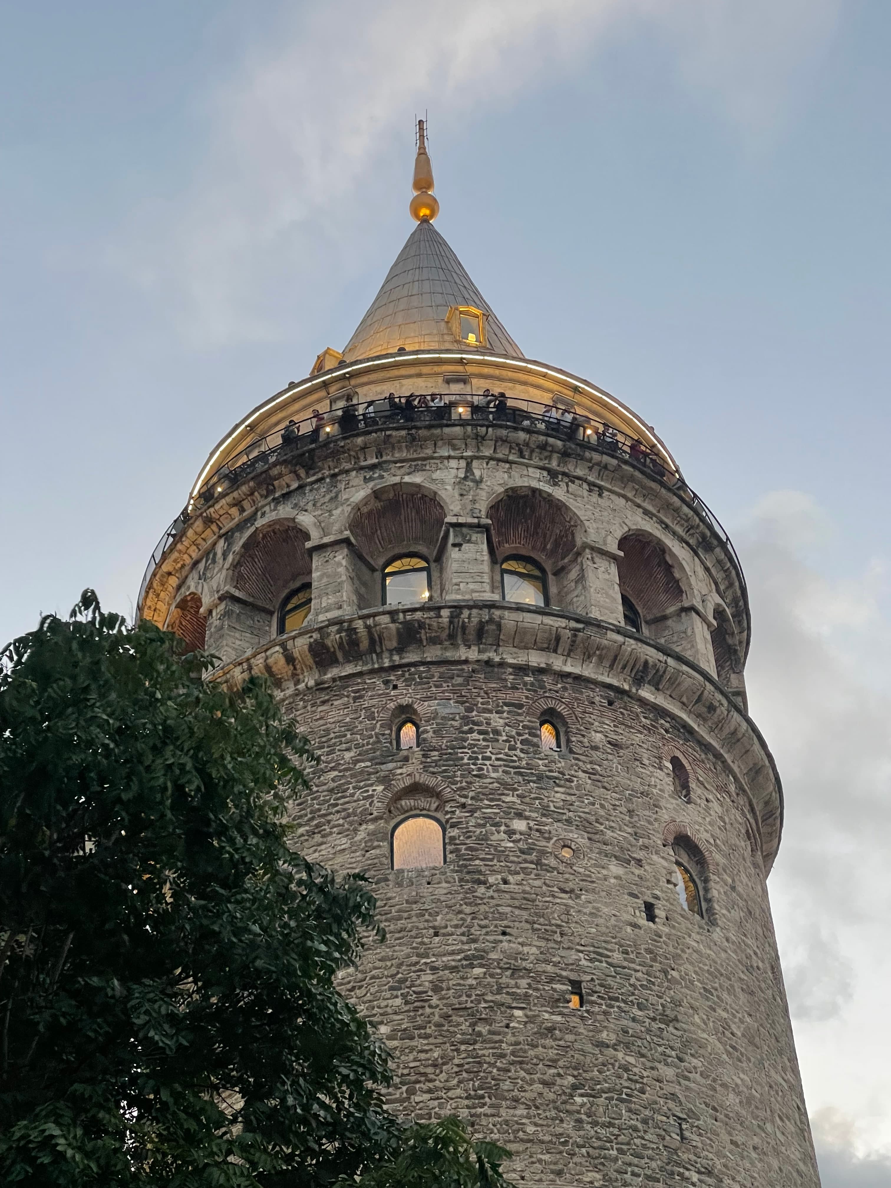 A spired building reaches for the sky at dusk.