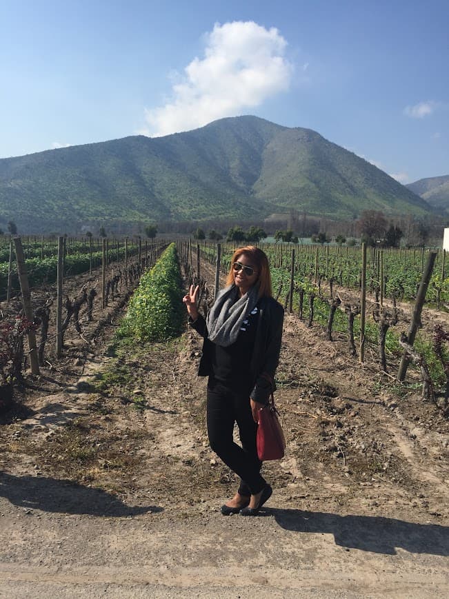 Advisor posing at a wine vineyard in Chile on a sunny day