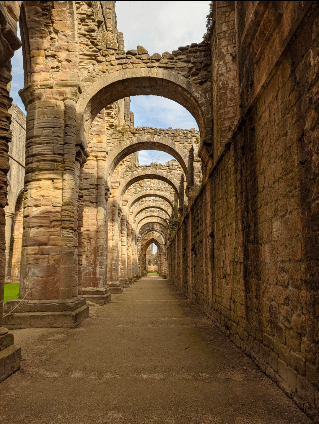 The historic ruins of St John's Abbey in Edinburgh, showcasing ancient stonework and remnants of a once-grand structure.
