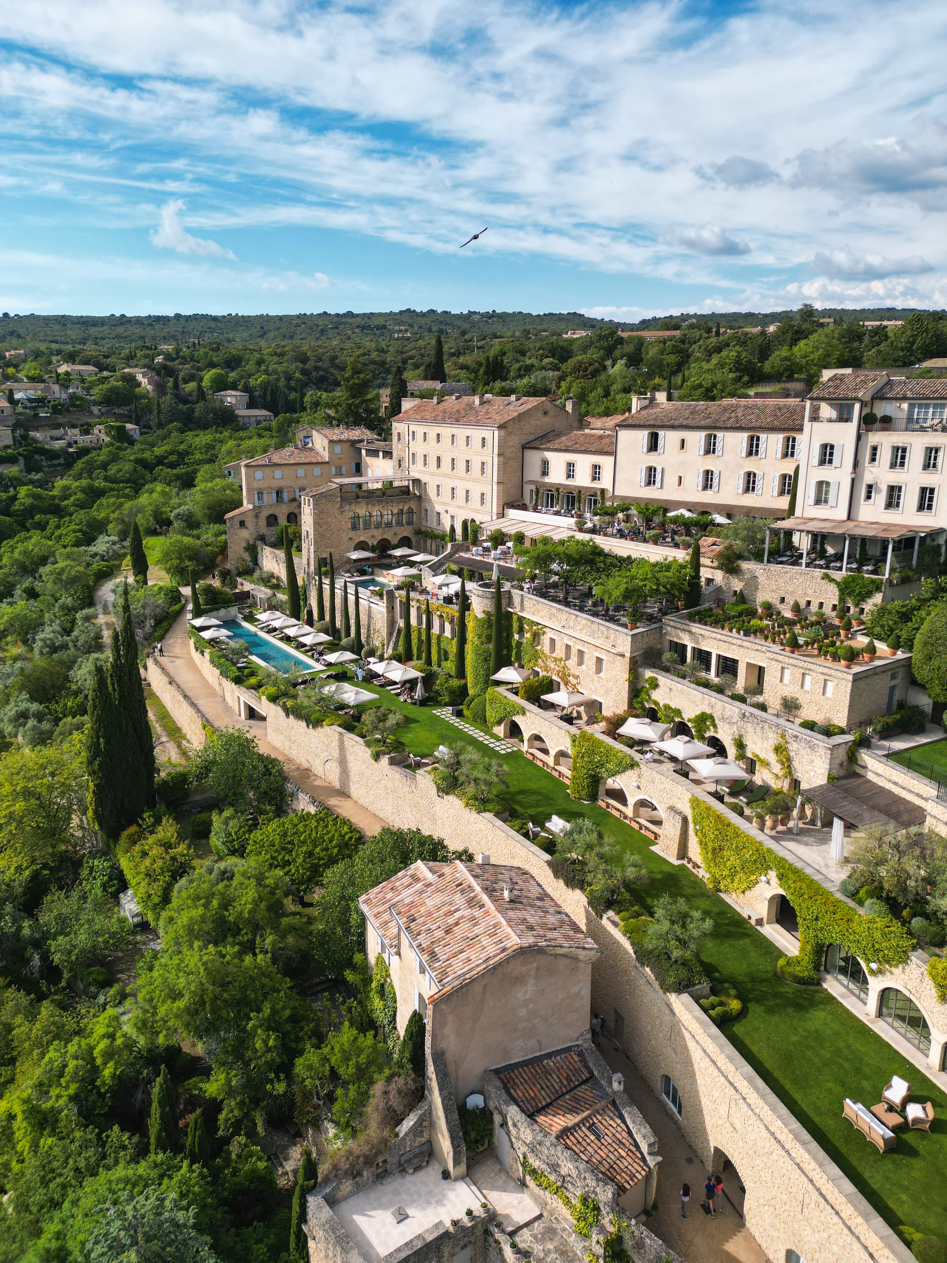 Aerial view of a hillside resort on a sunny day