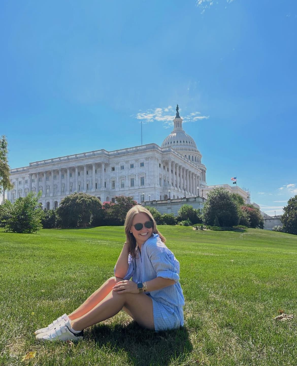 Advisor sitting on the lawn of the White House on a sunny day