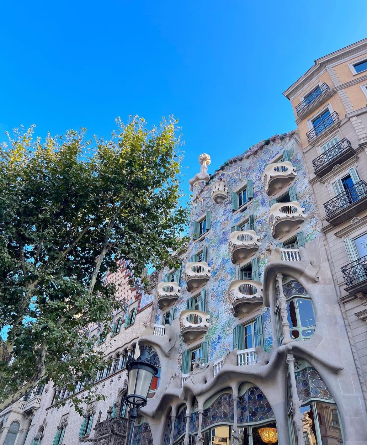 View of a building designed by Gaudi in Barcelona on a clear day