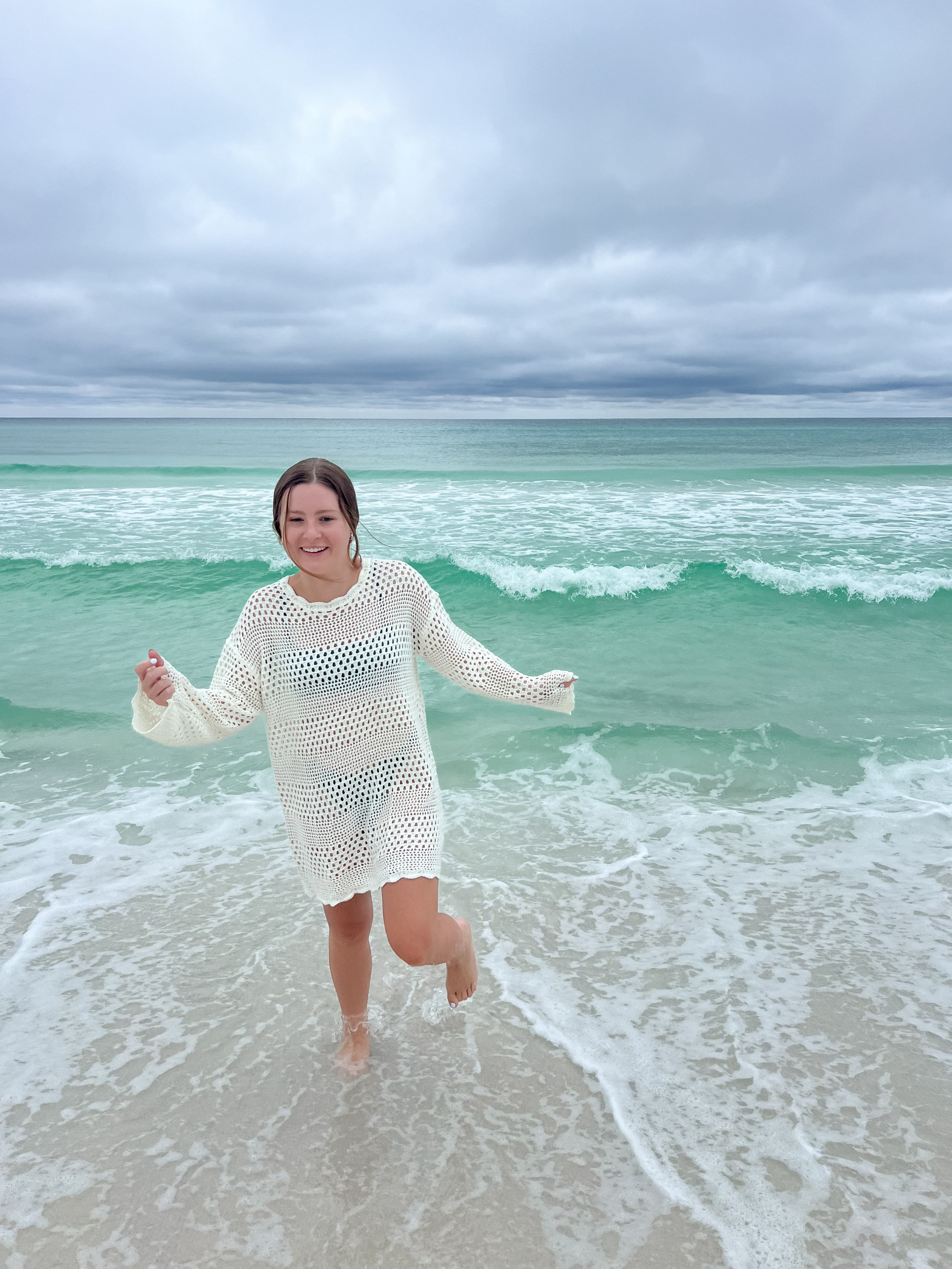 Blair playing in the ocean during the daytime.