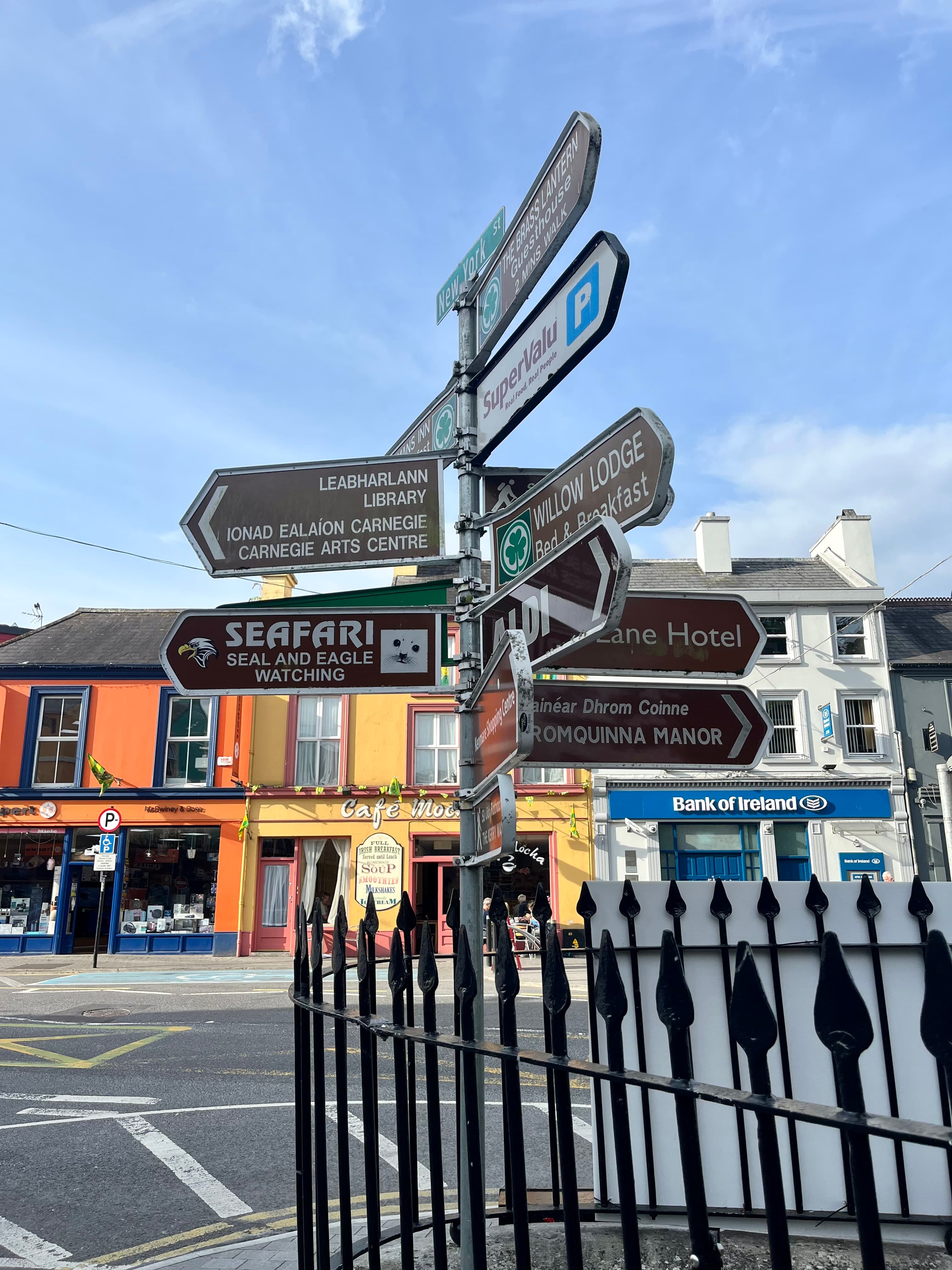 A street sign displaying multiple arrows pointing in various directions, indicating diverse routes and destinations.