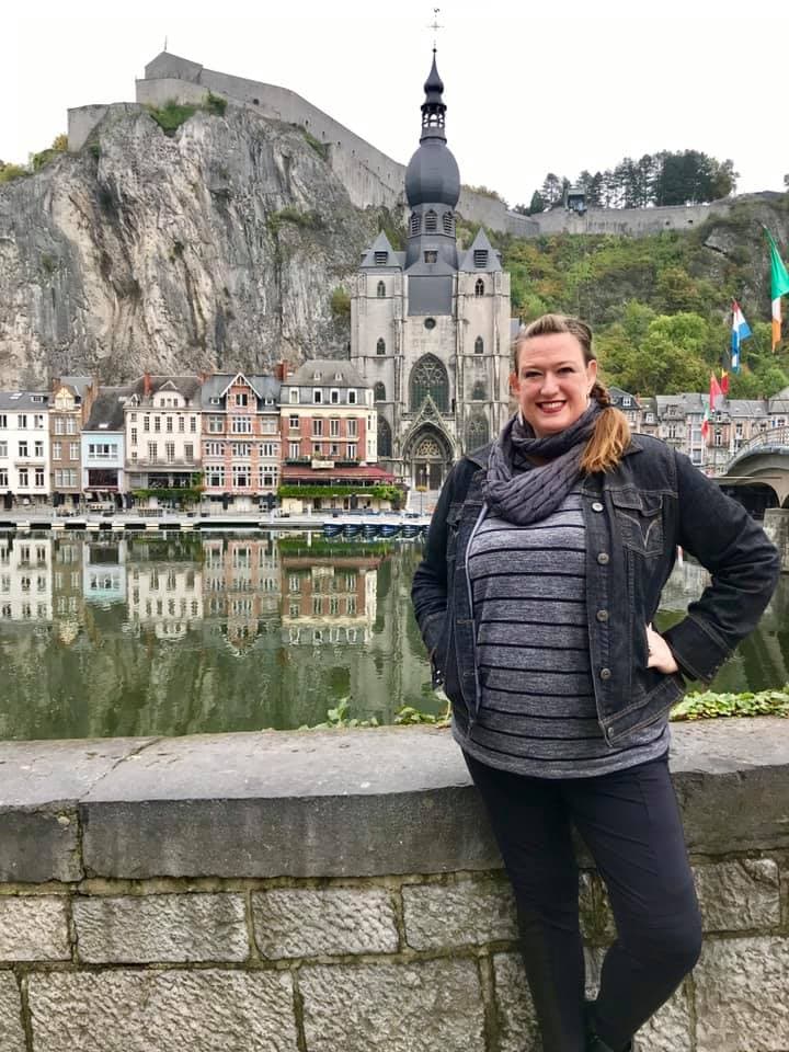 Standing in front of a historic building.