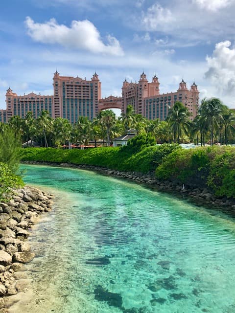 View of a crystal clear river running beside the Atlantis resort in the Bahamas on a sunny day