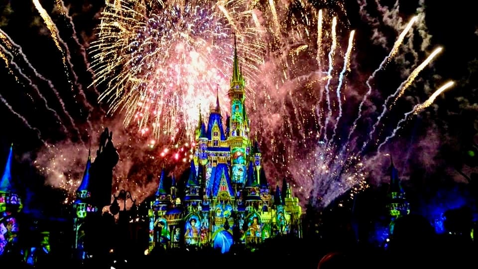 View of a large display of fireworks over Cinderella’s Castle at Disney World