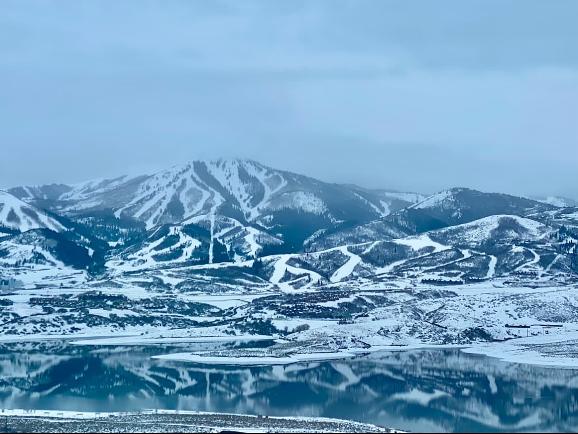Panoramic view of snowy mountains on a cloudy day