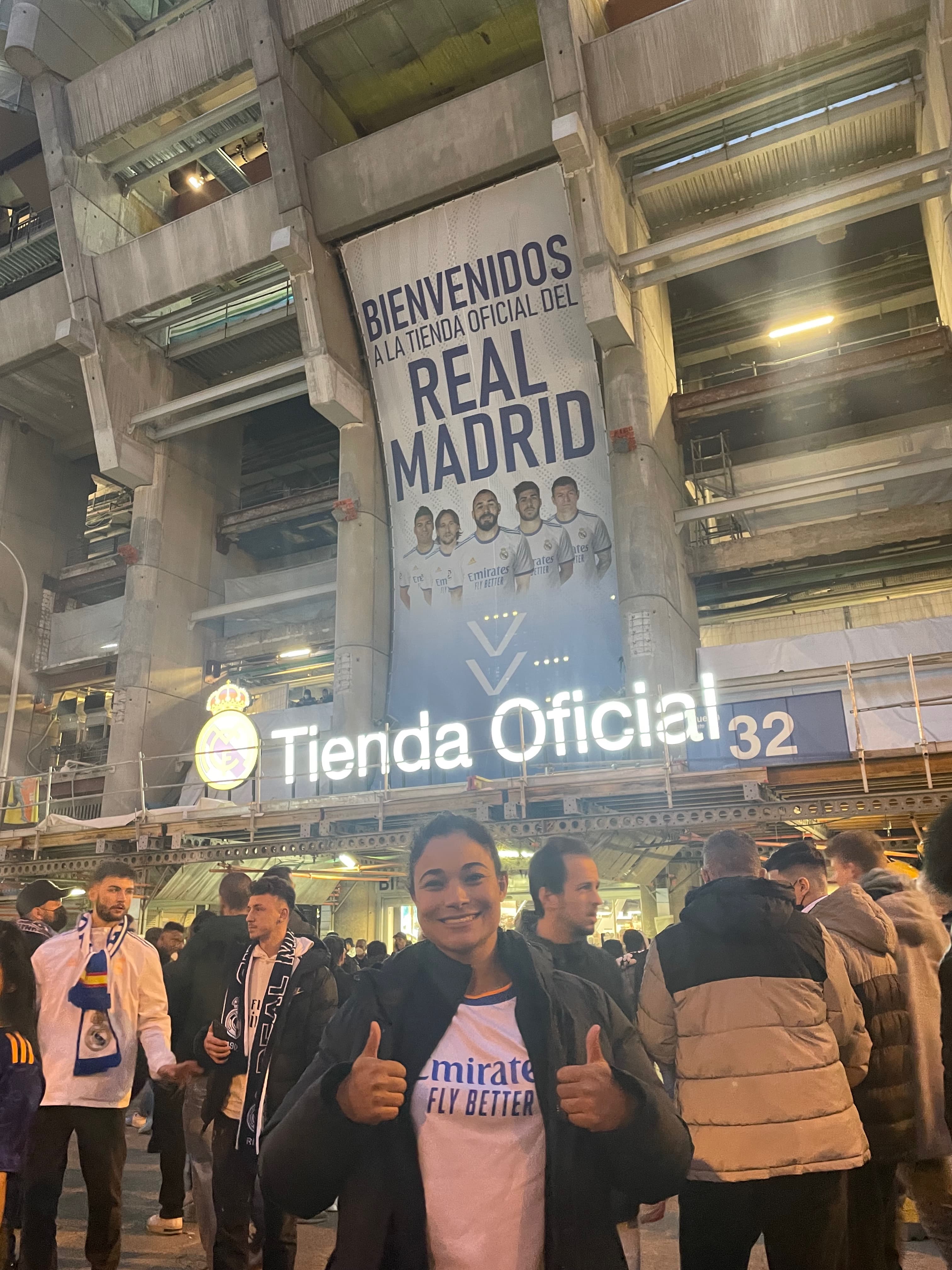 Advisor posing for an image in front of a popular establishment.