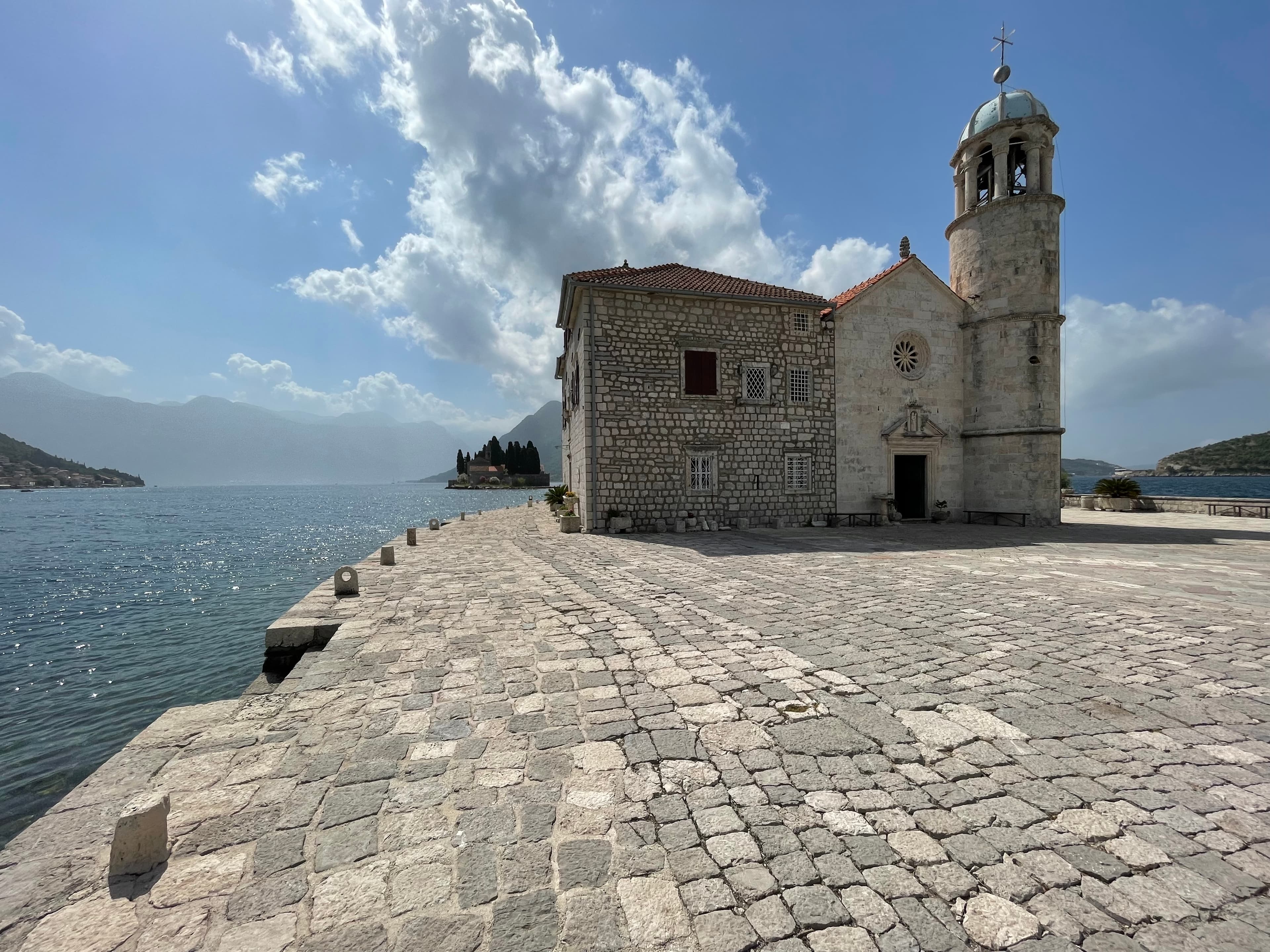 View of an old stone church on a small manmade island in the bay of Kotor, Montenegro