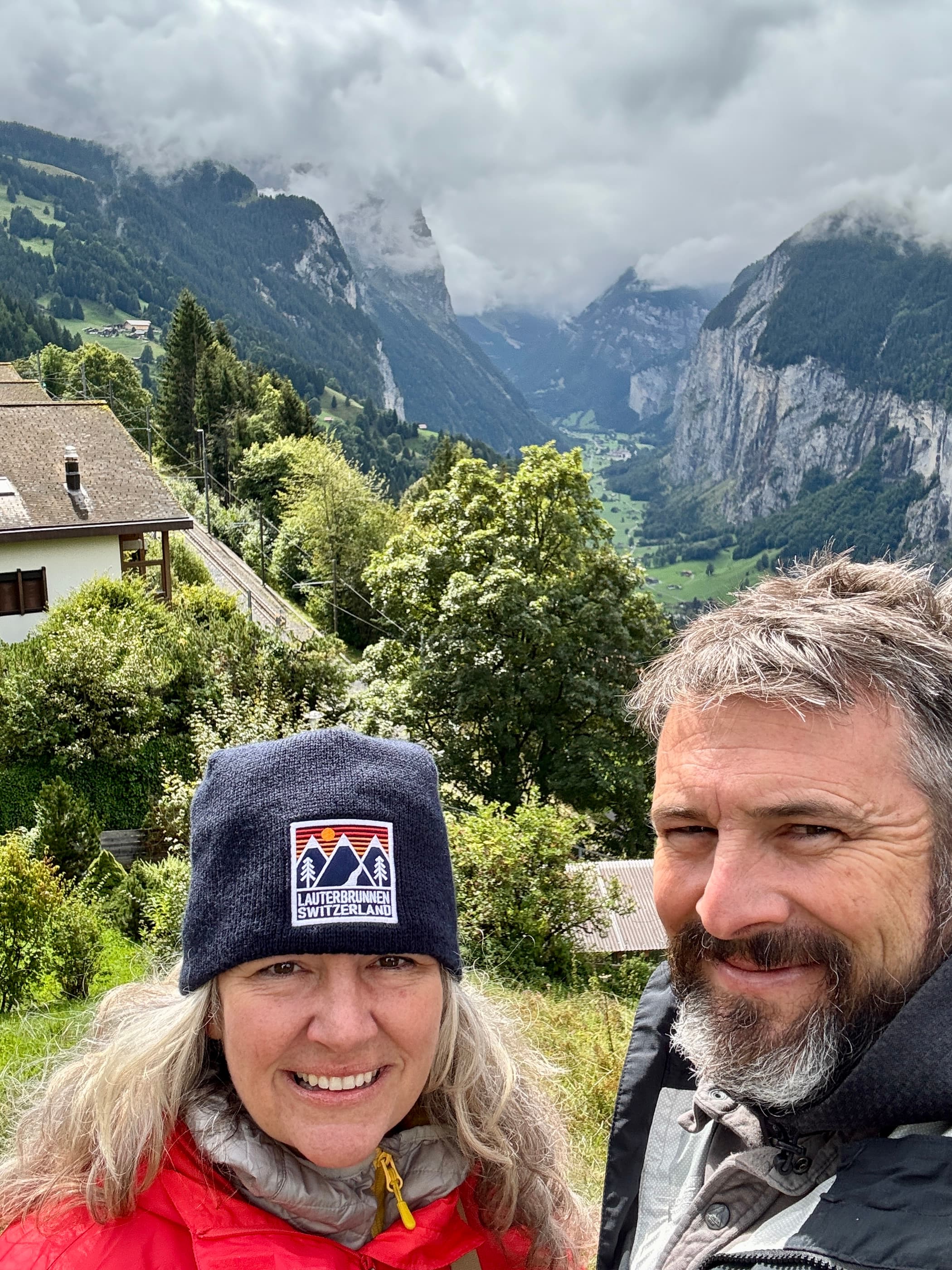Advisor and partner taking a selfie in the mountains