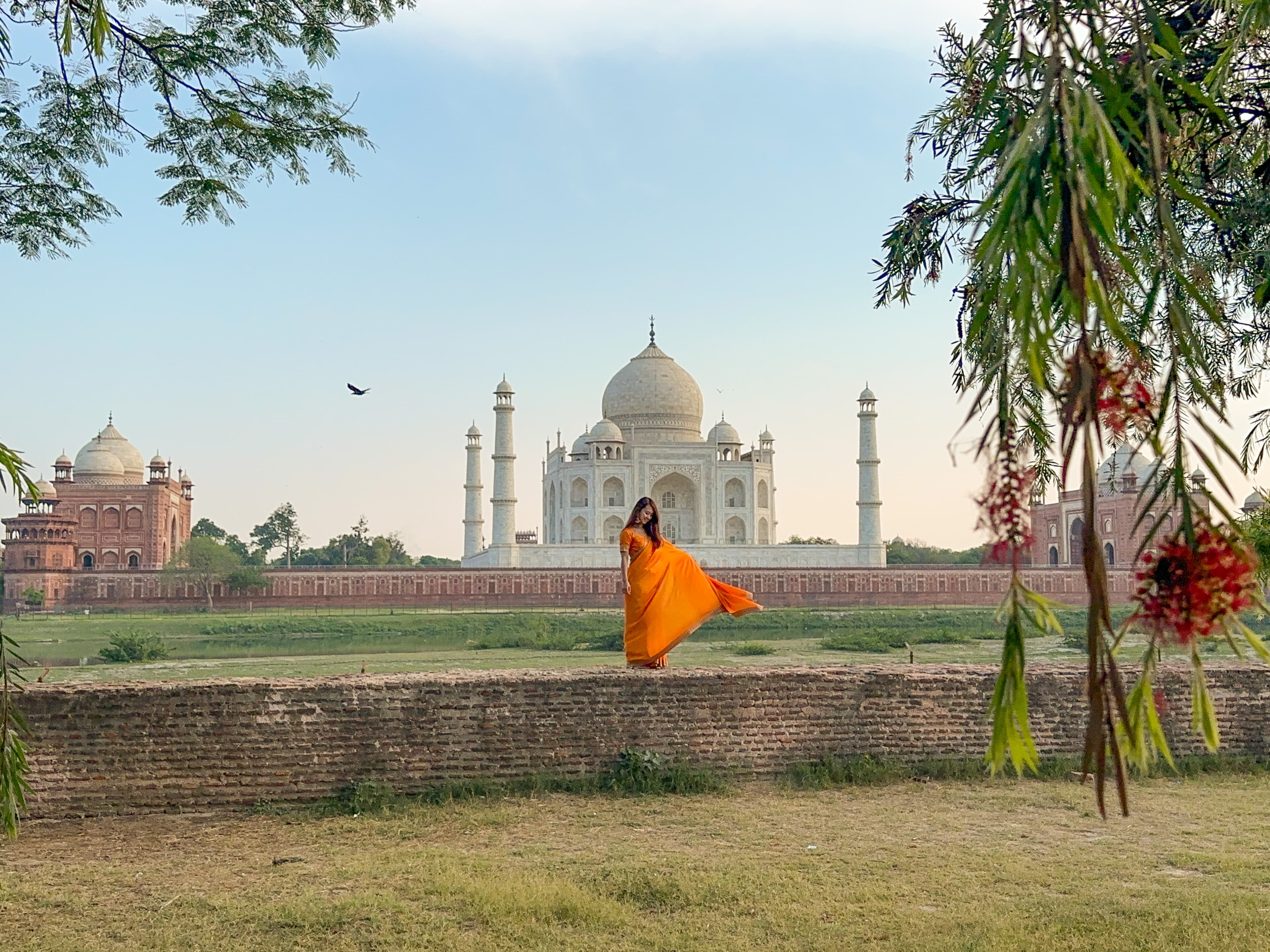 Advisor posing with a temple in the background during the daytime.