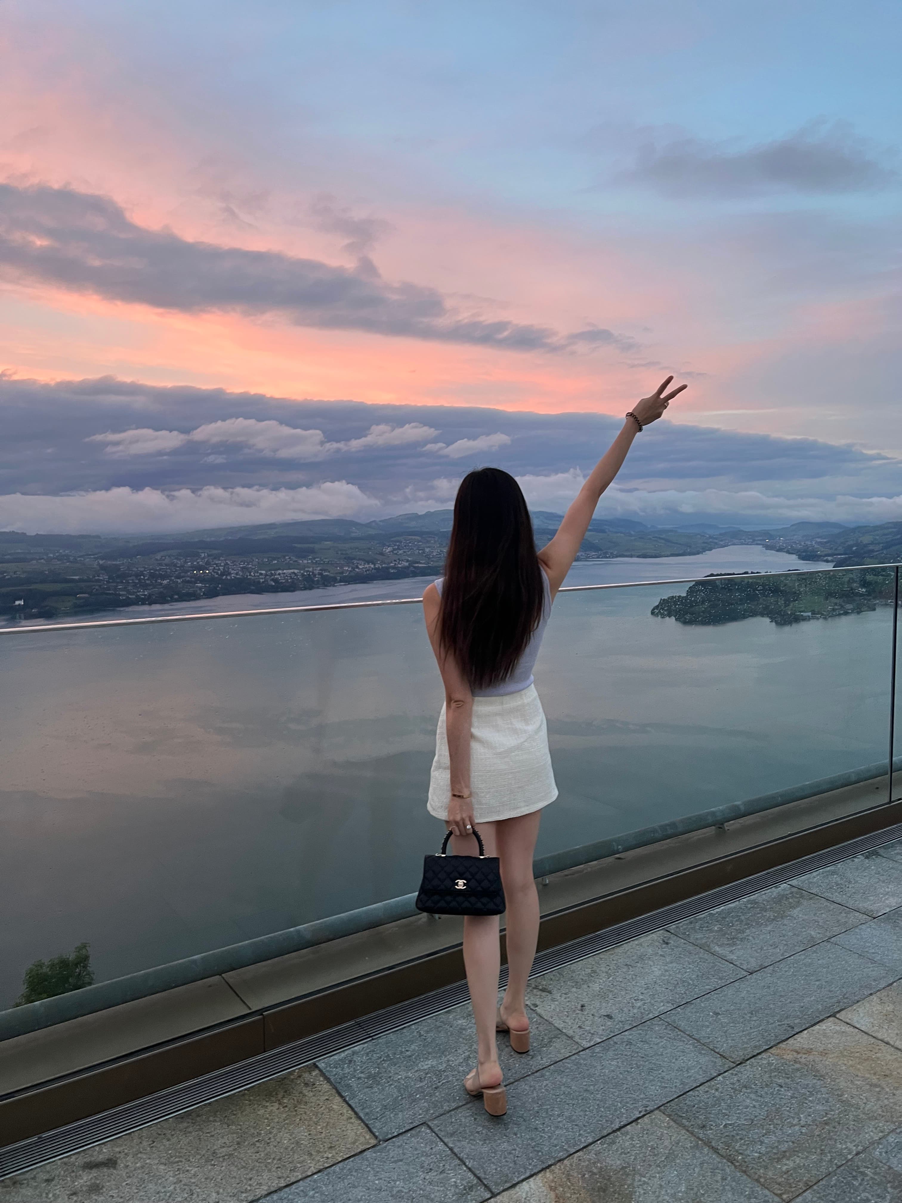 Looking out to pink sunset from sea.