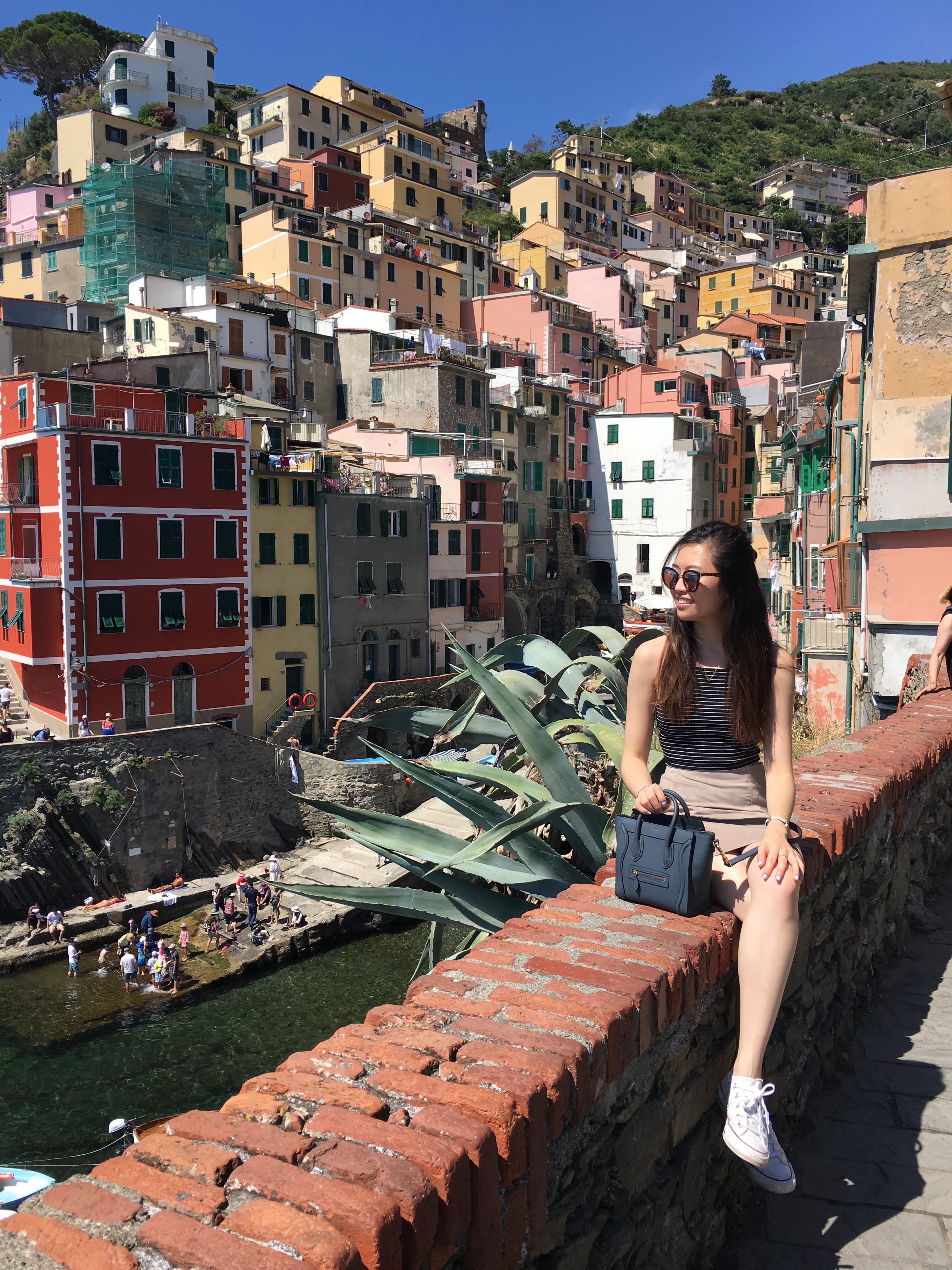 Girl looking out to town during the day.