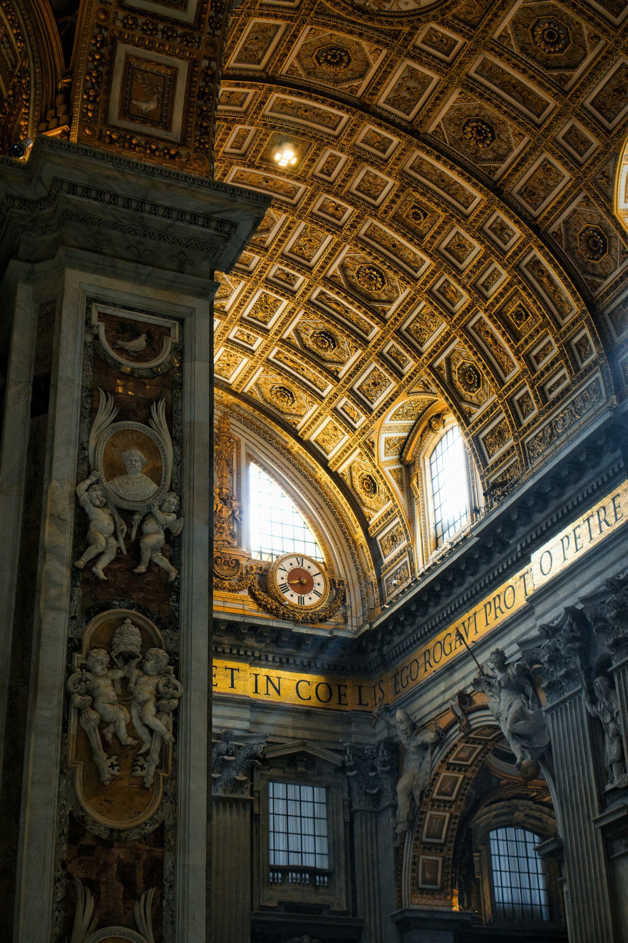 The arched and carved interior roof of a basilica.
