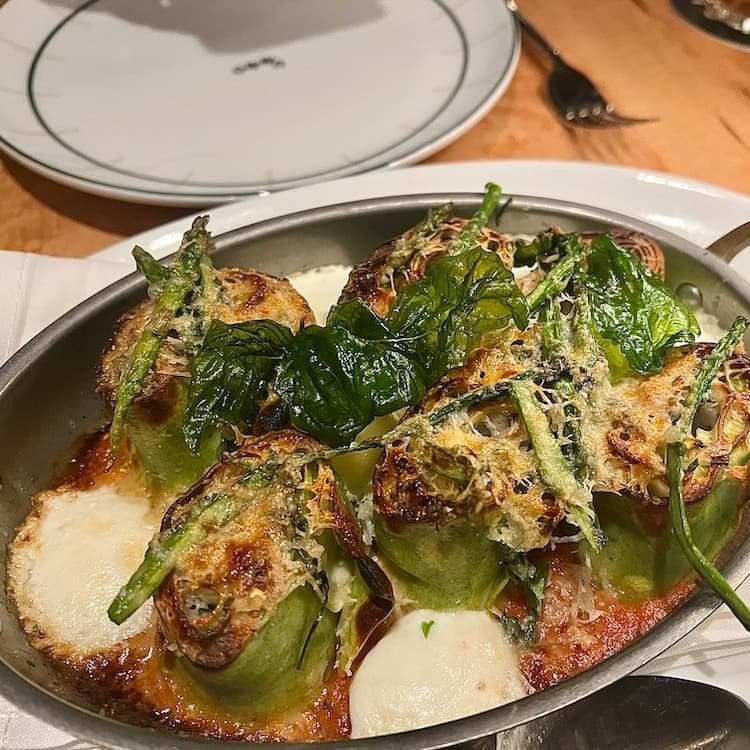 A gravy in a steel pot.
