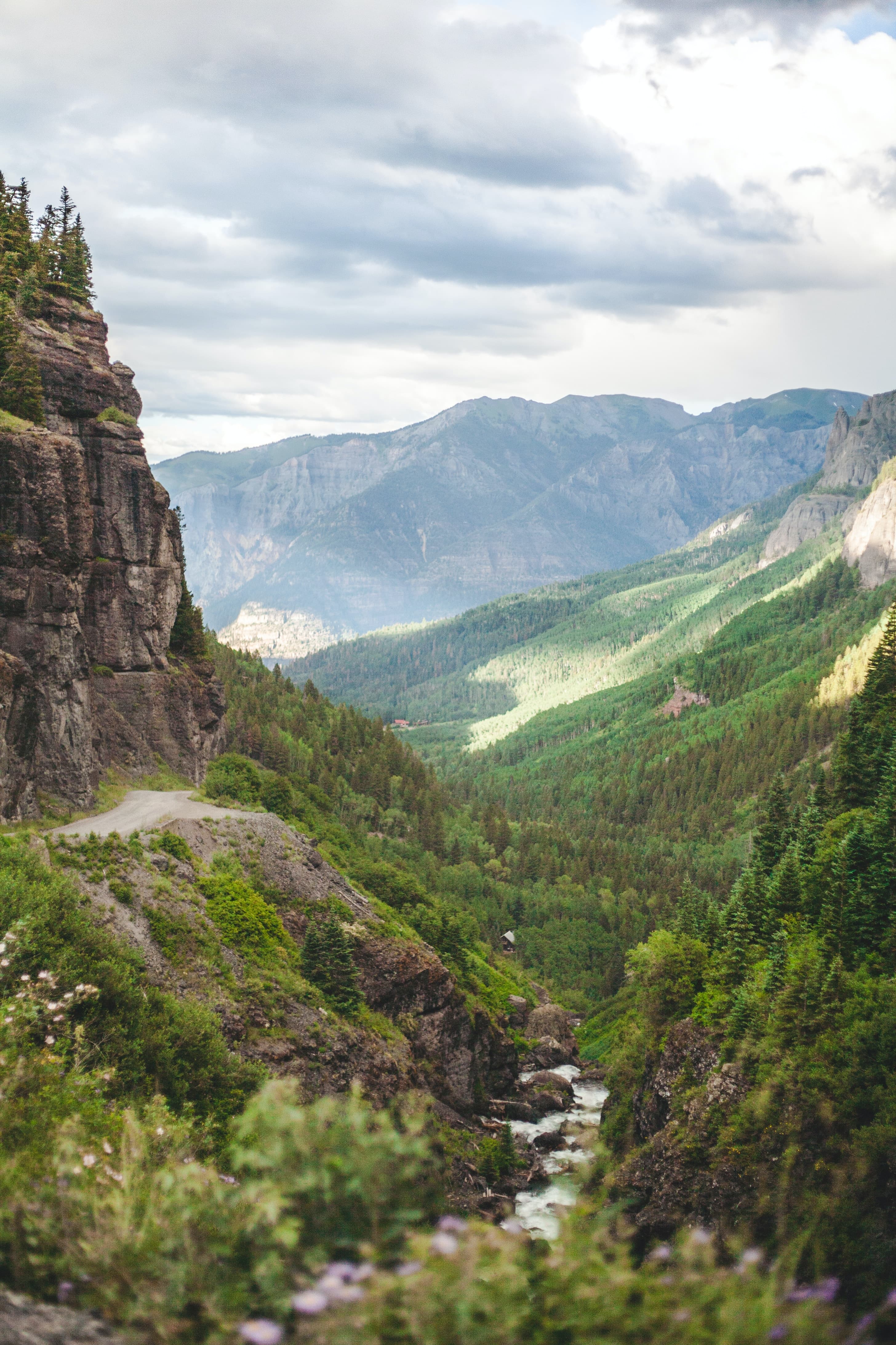 View of a valley with mountains and a river in Colorado.