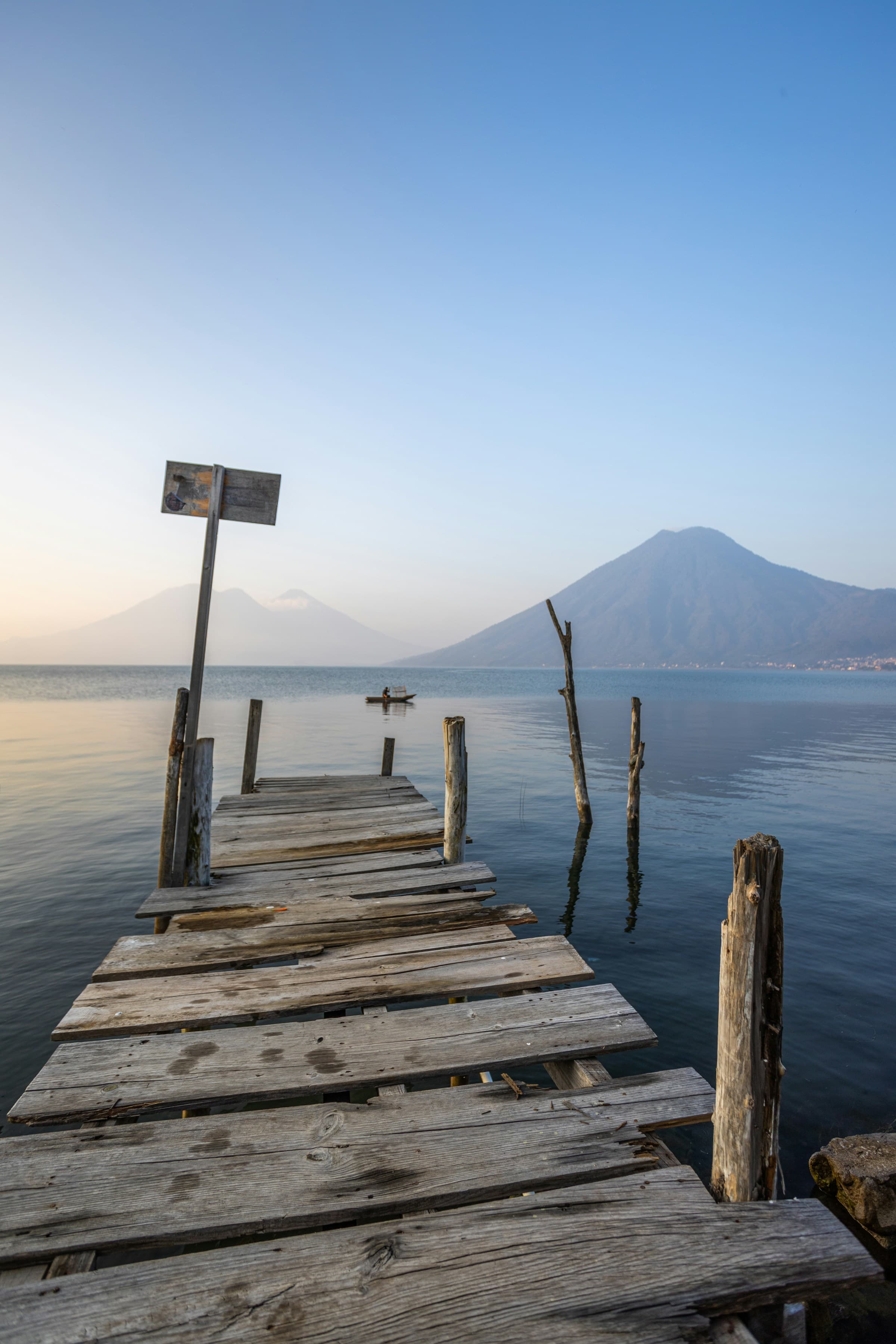 A wooden dock at the water of Lake Atitlan.