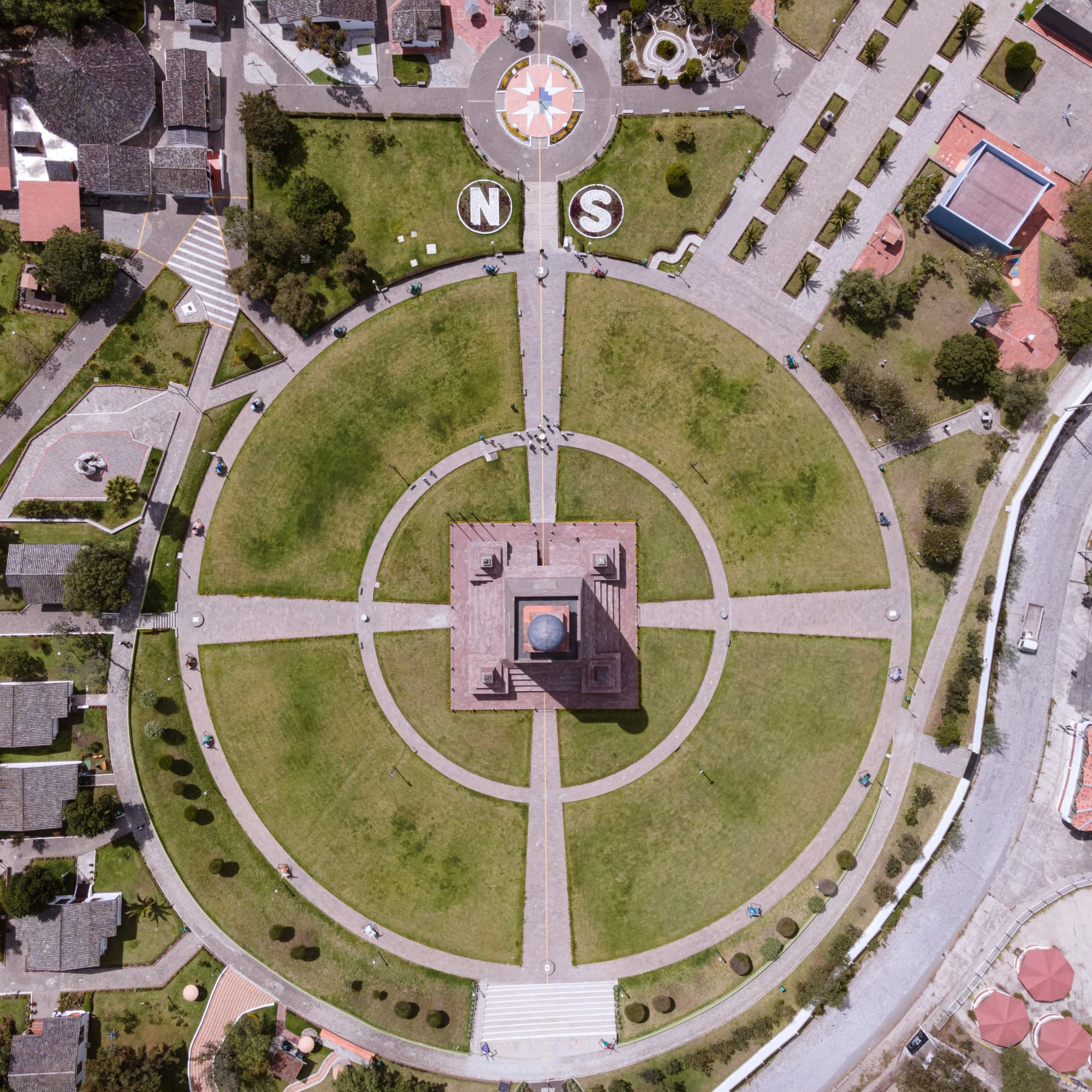 Aerial view of a compound surrounded by buildings.