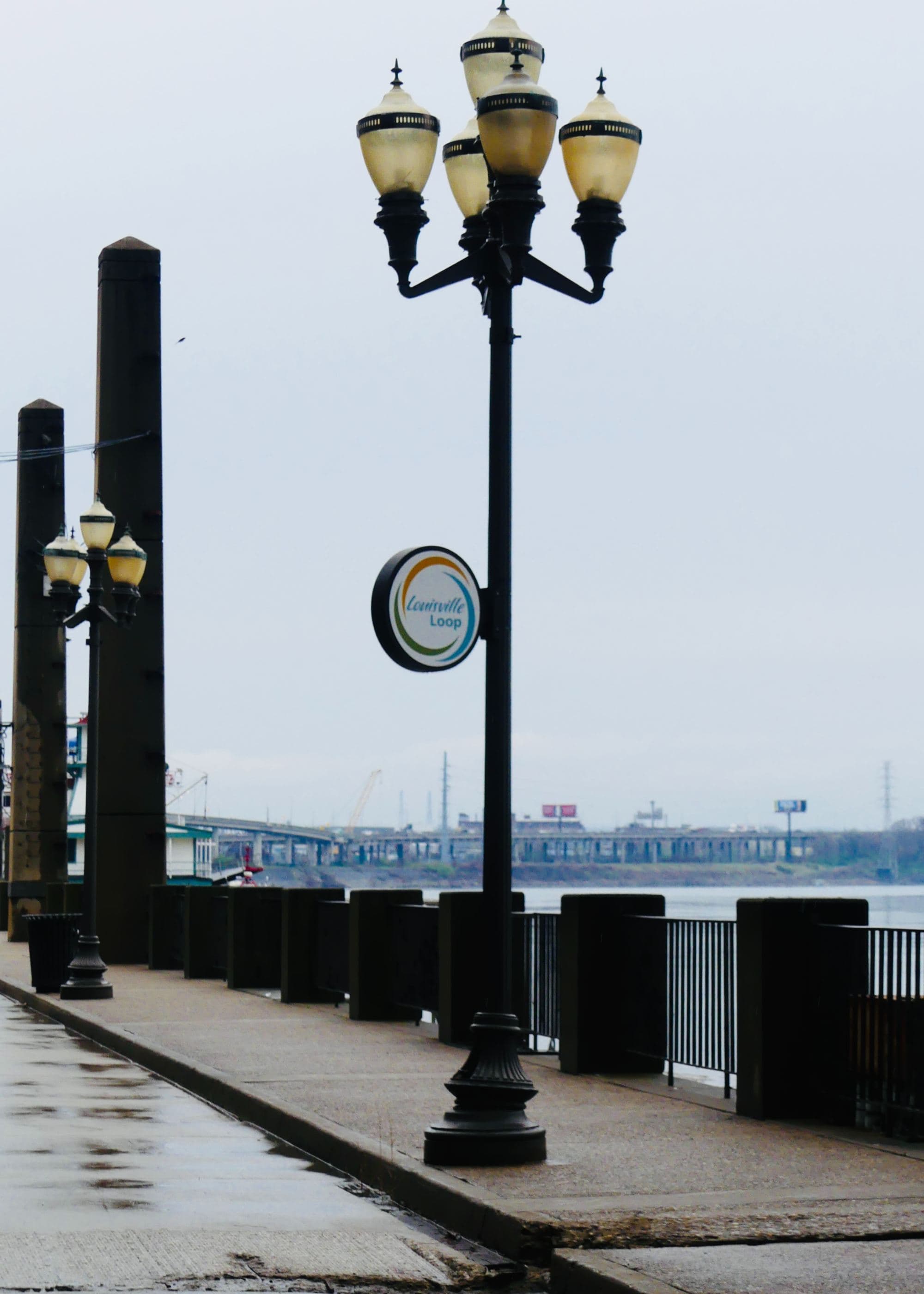 River walk with light posts during daytime.