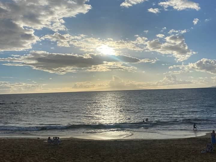 Beach on a partly cloudy day.