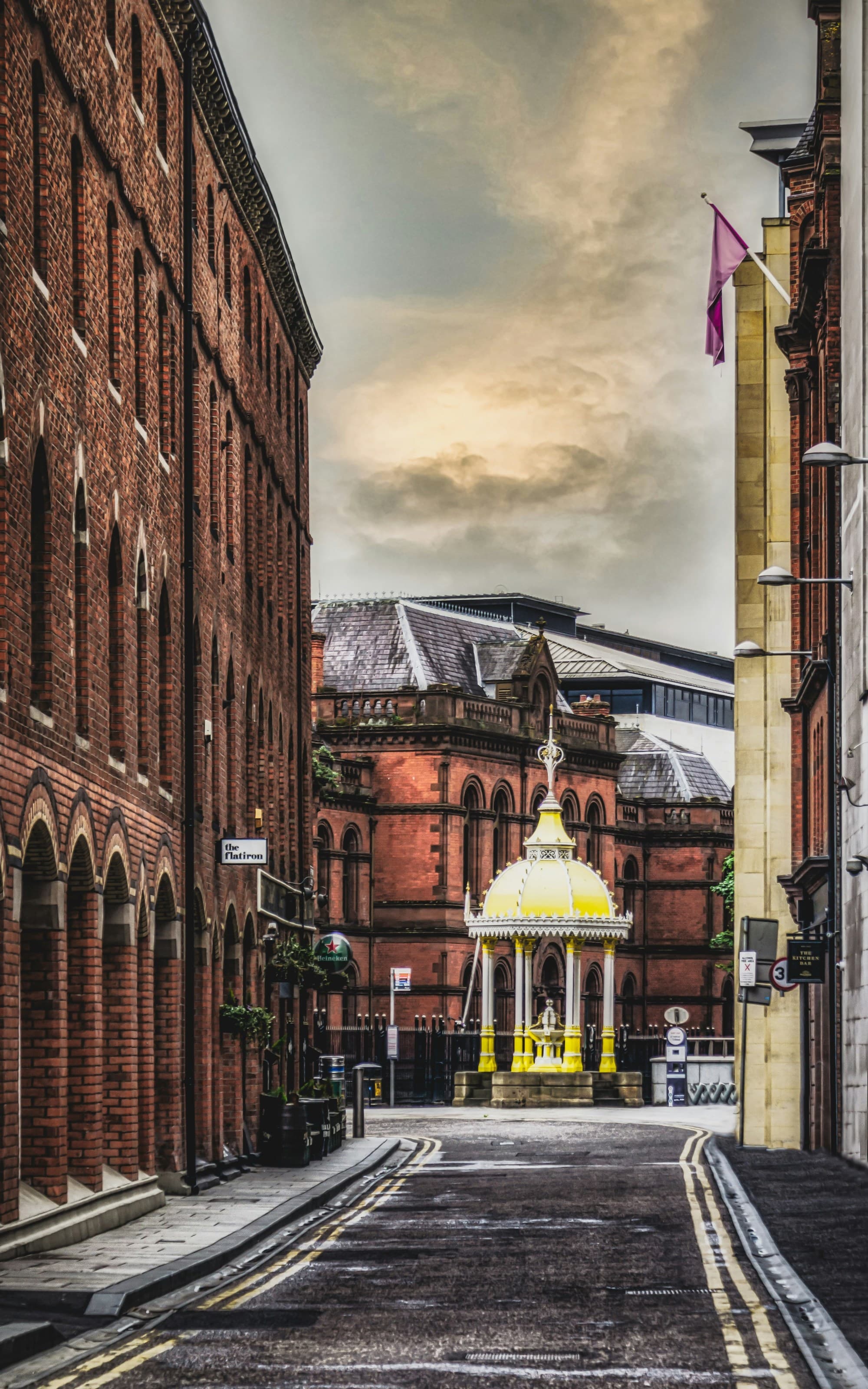 A street between buildings.