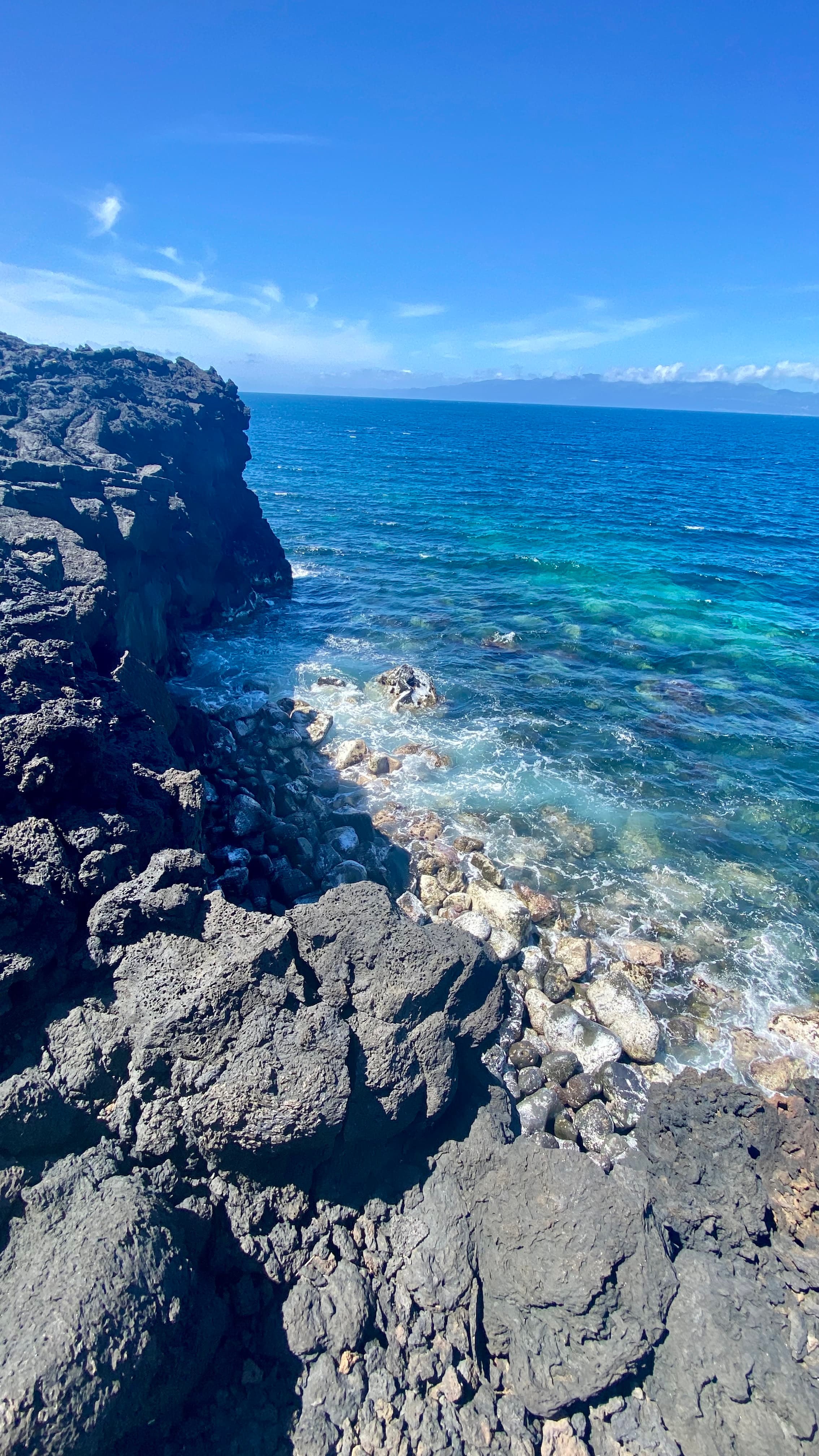 Rocky cliffs next to a body of water