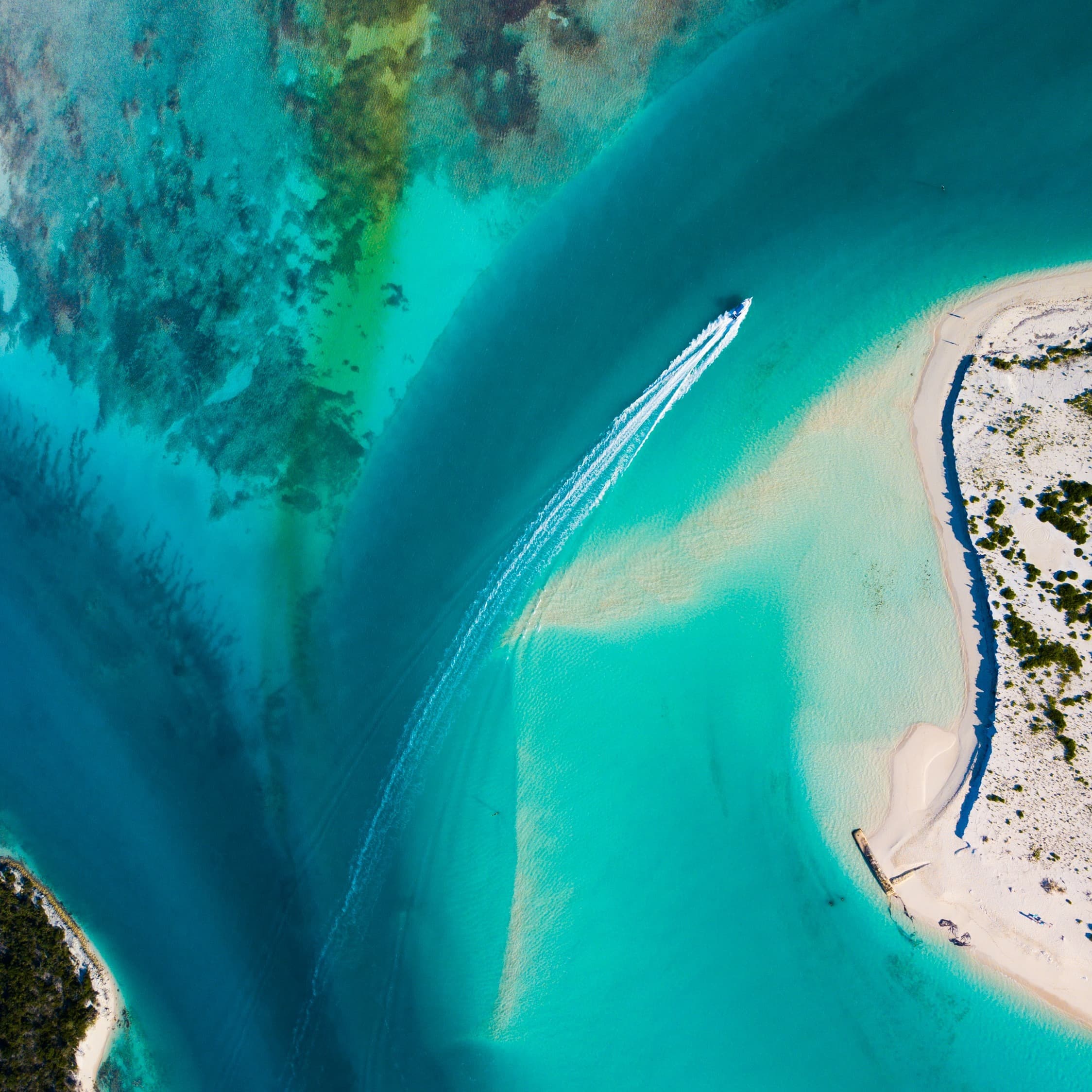 Aerial view of sea with a boat.