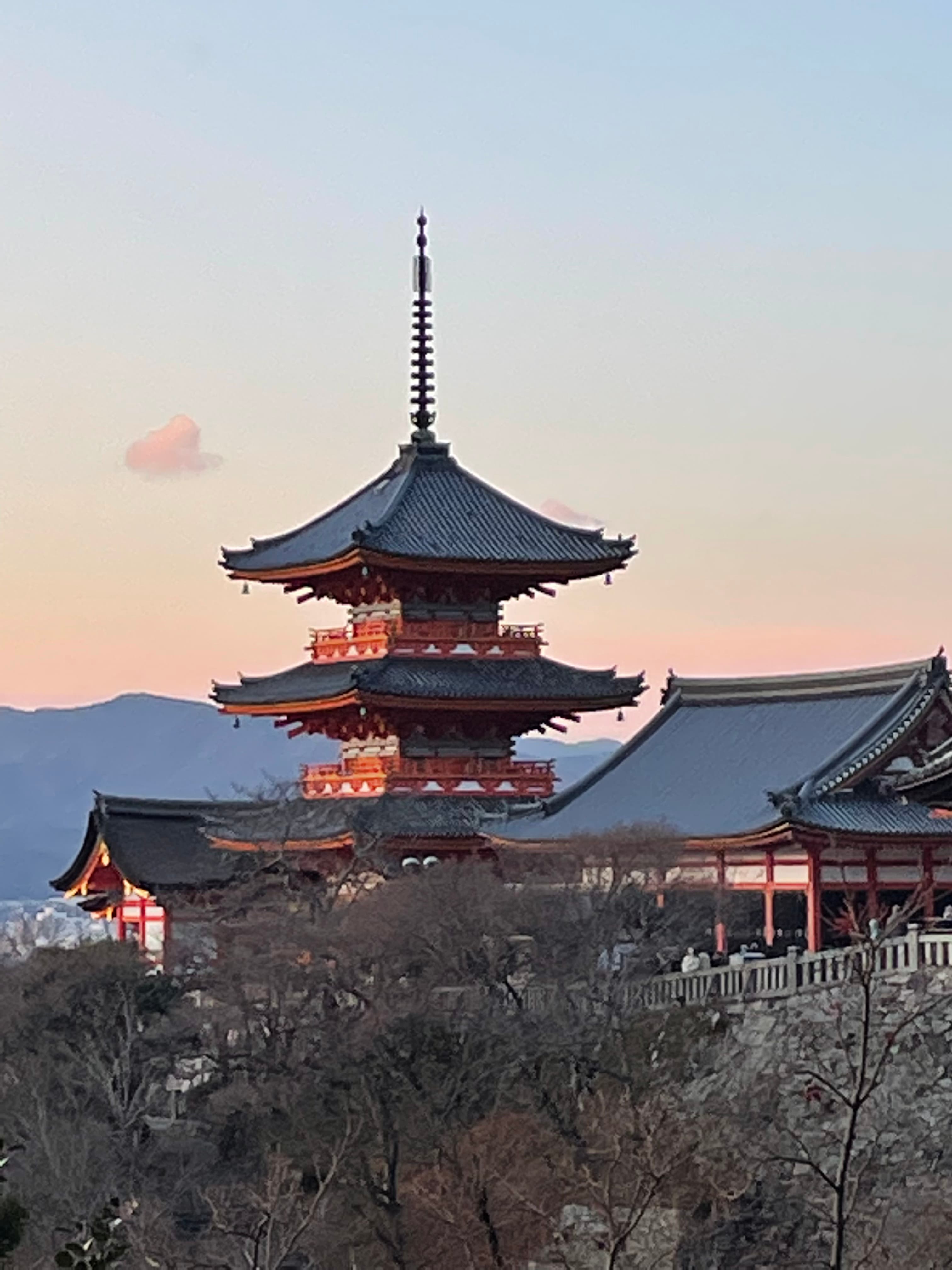 Kiyomizu-dera Temple in Kyoto in front of a sunset sky