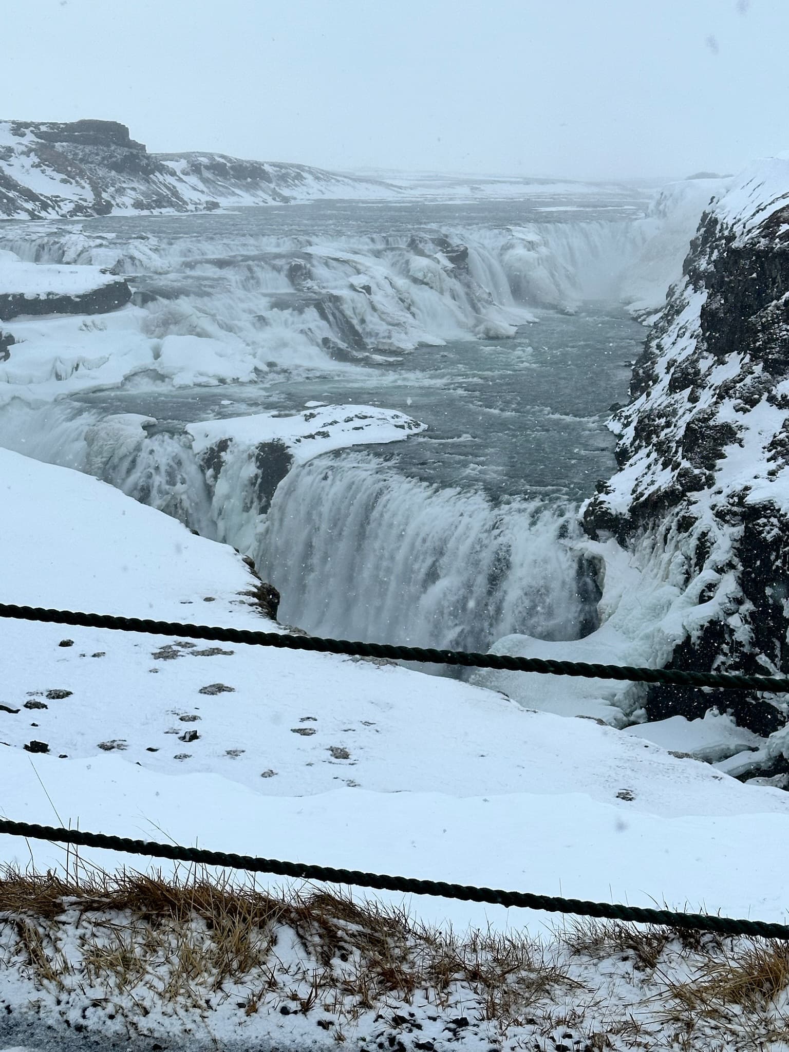 Gullfoss waterfalls in the winter, covered in snow.
