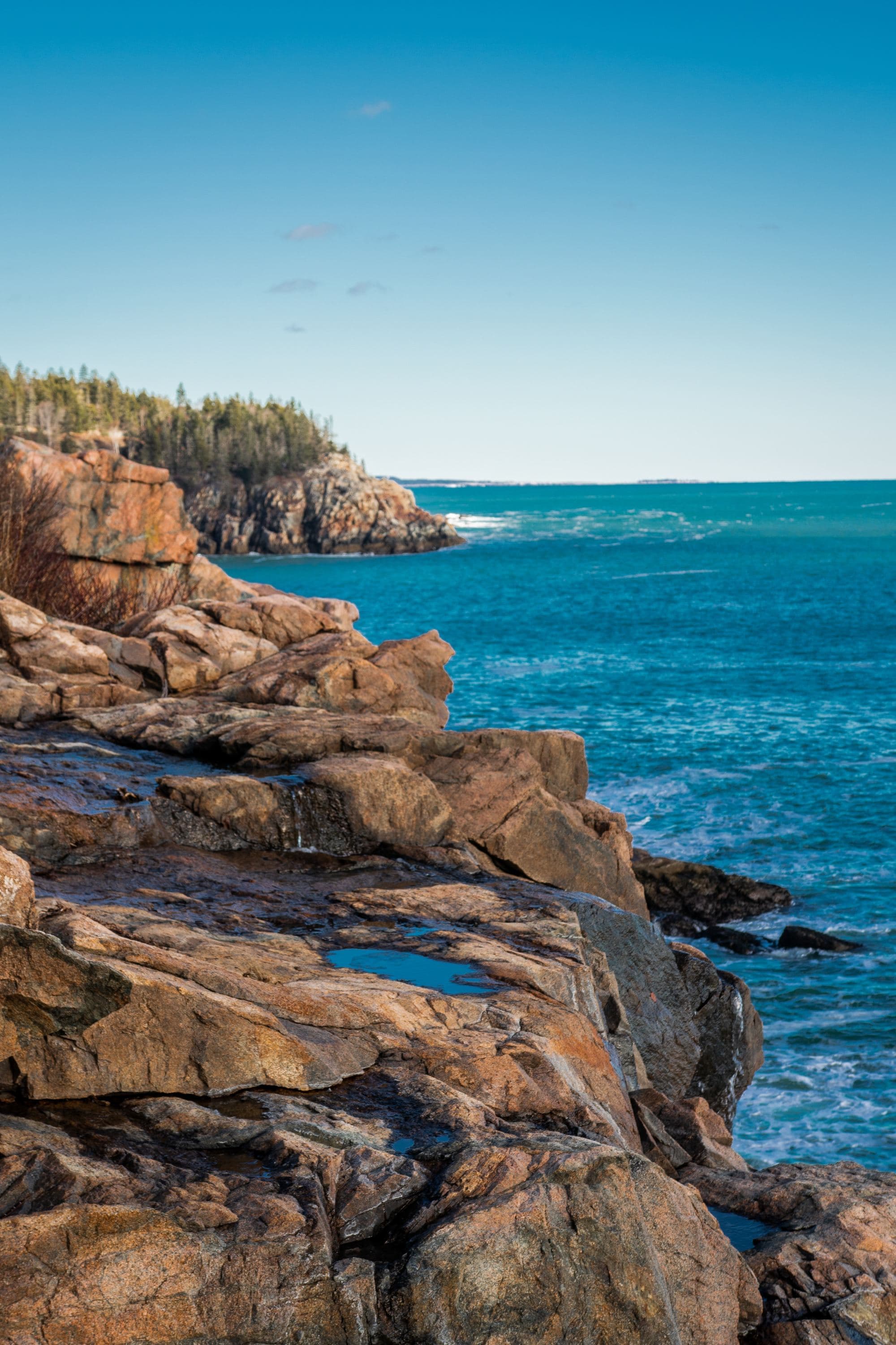 rocky cliff coast and ocean on a clear sunny day