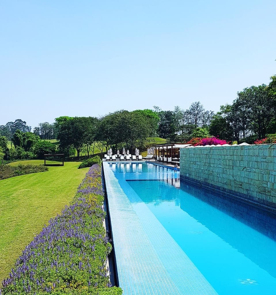 A resort with pool and garden.