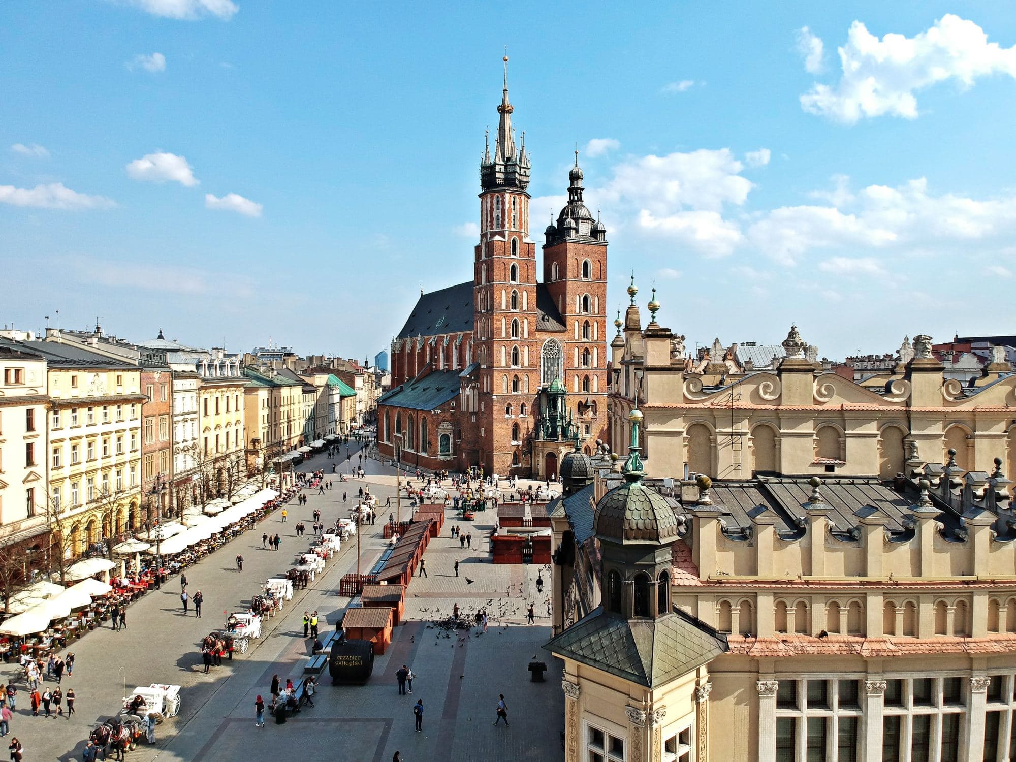 main market square in a old city with vendor tens lining the street