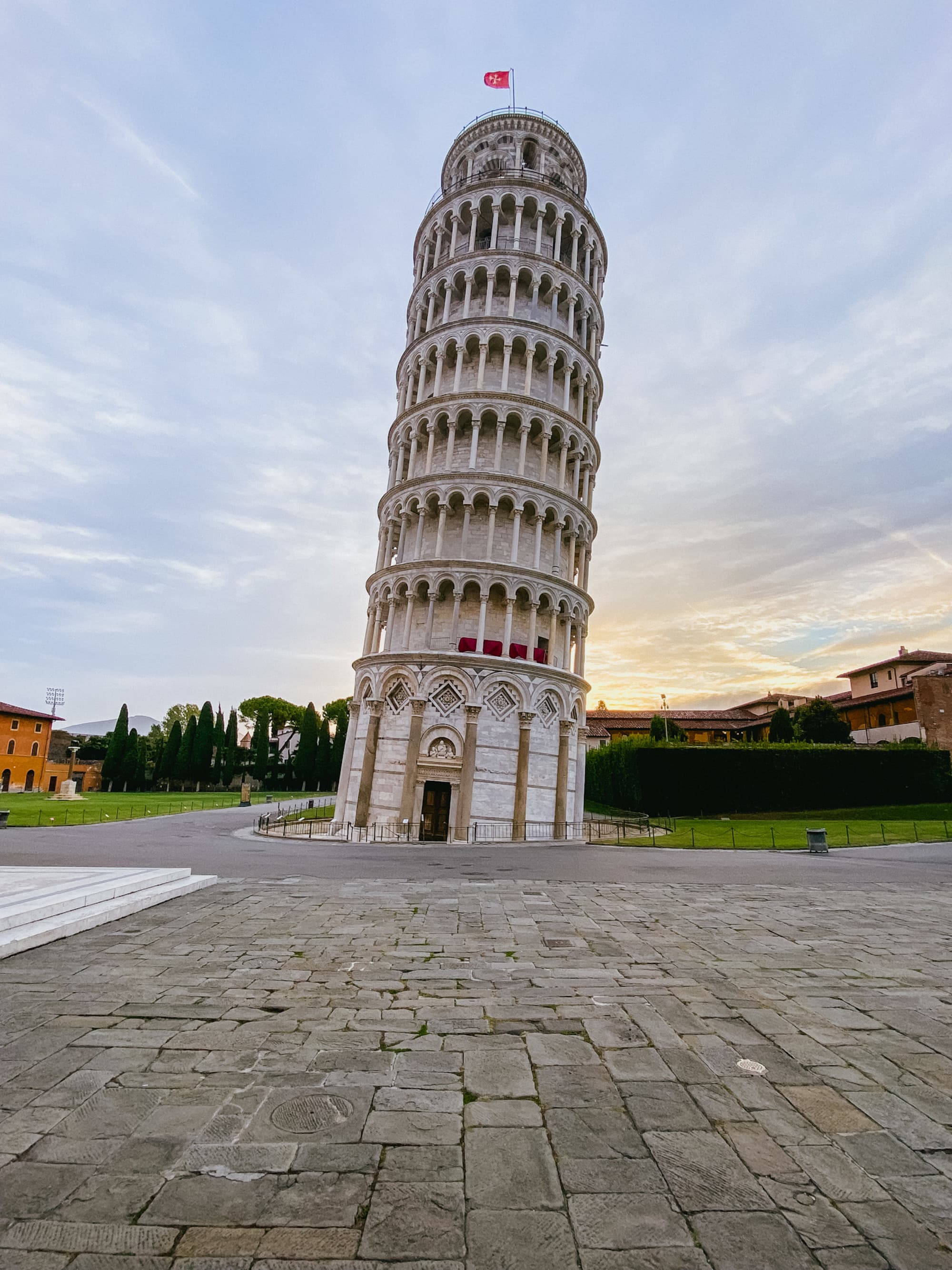A low-angled shot of the famous Pisa Tower, taken during daytime.