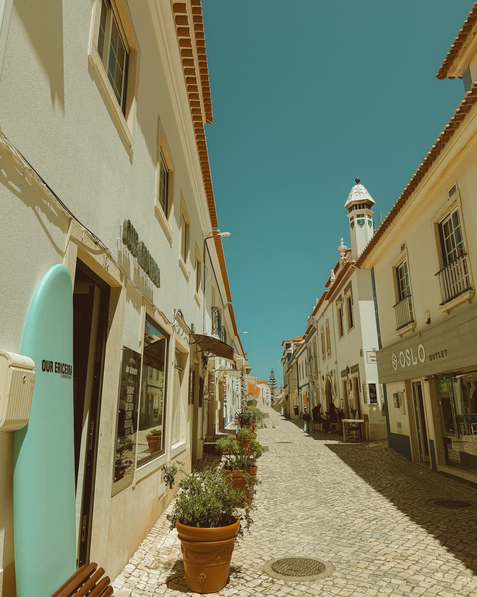 Narrow street in an old downtown during daytime.
