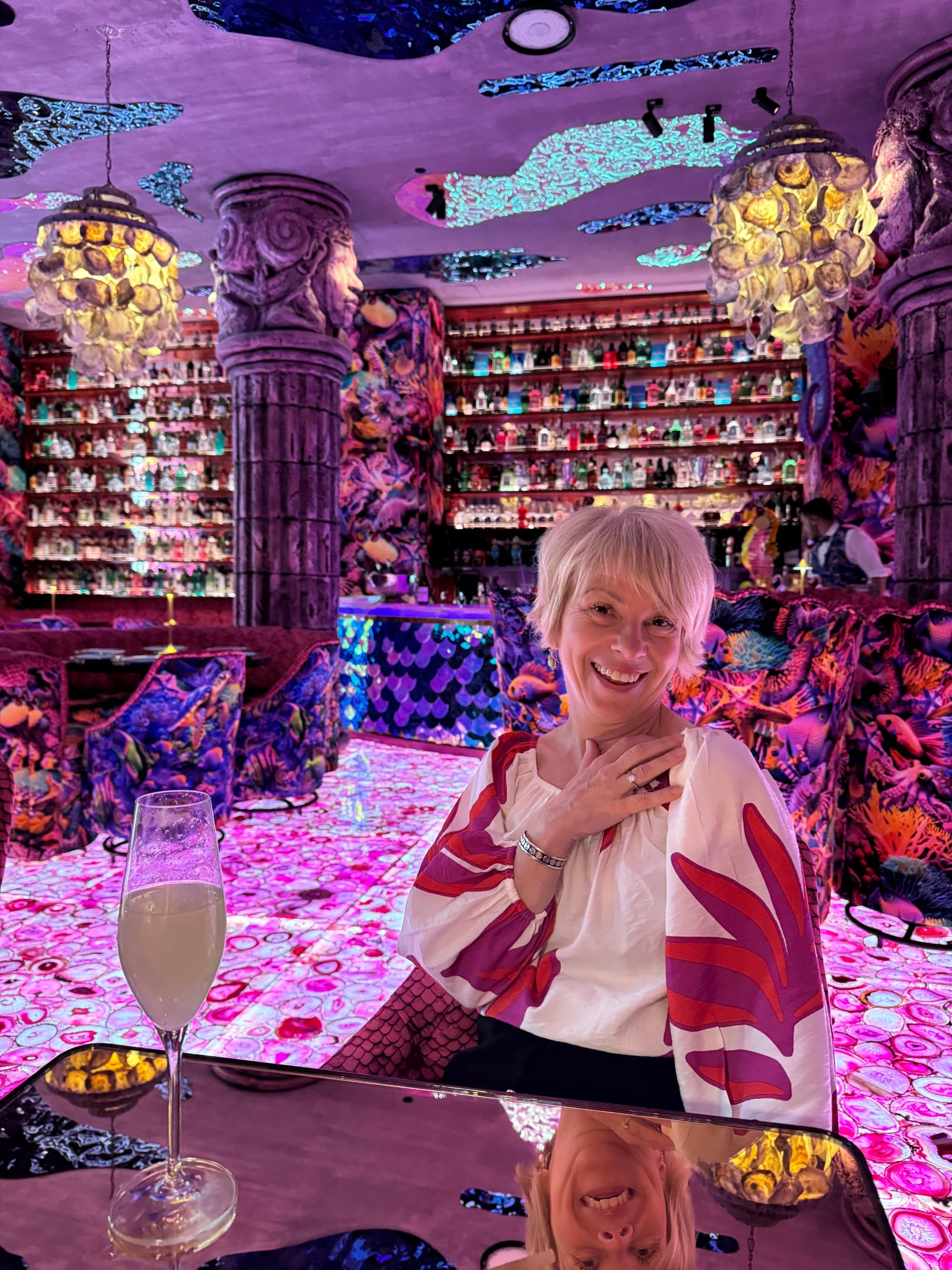 Woman in a colorful bar.