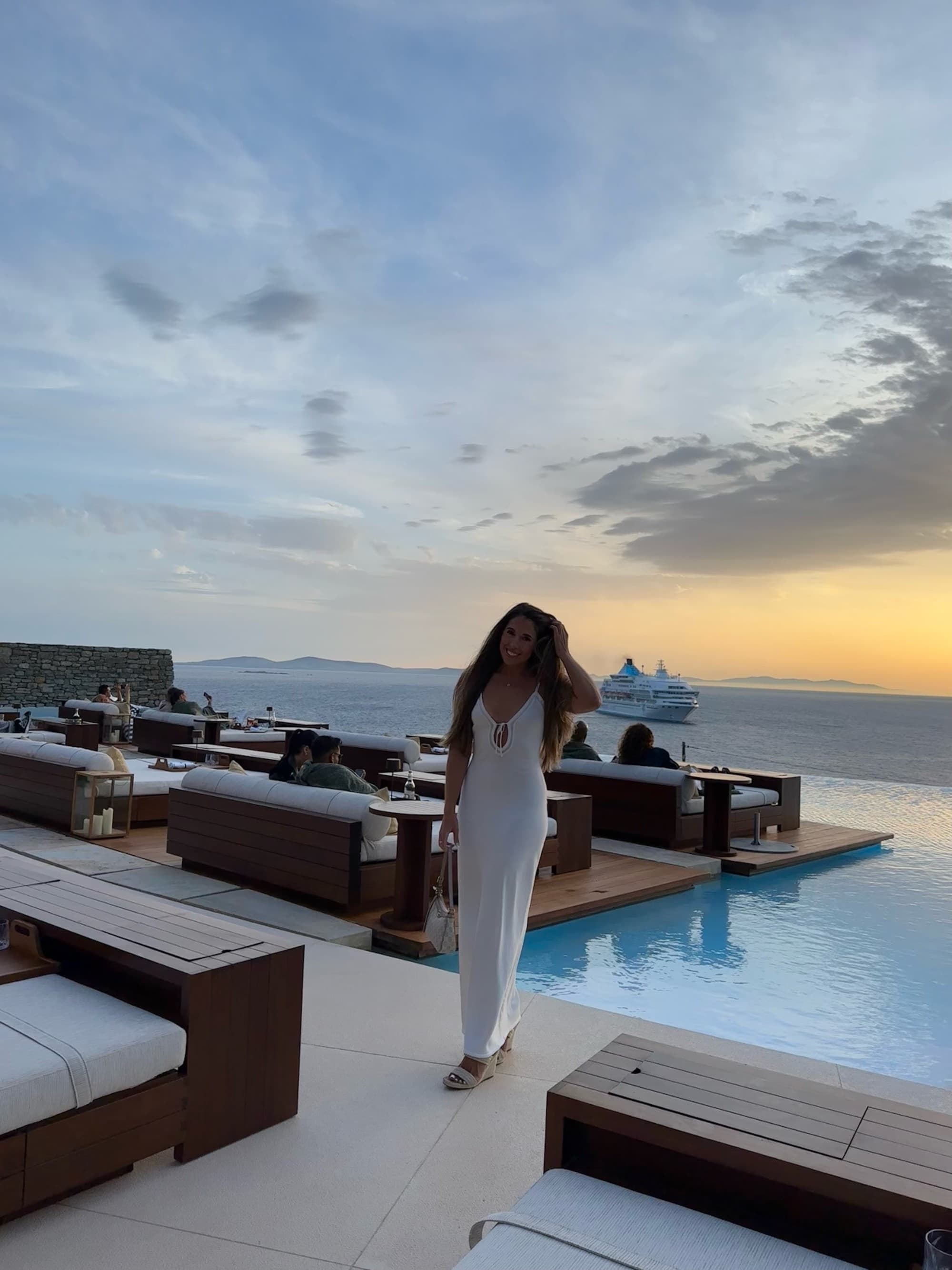 A woman on a beach side restaurant.