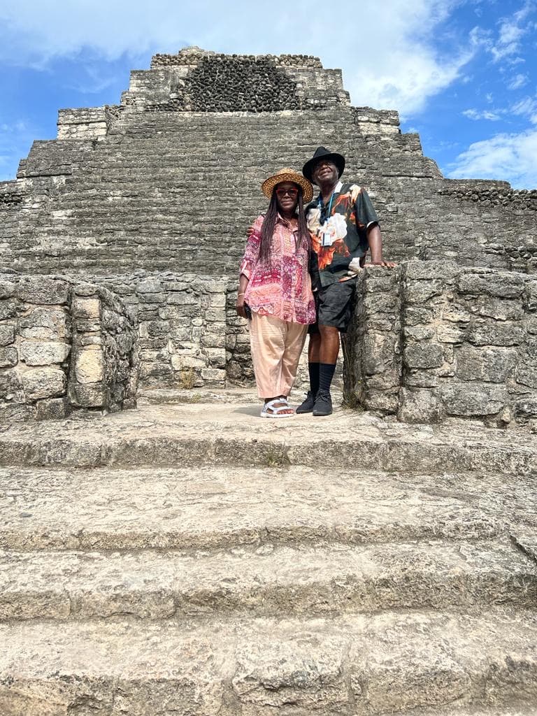 Travel advisor posing in front of ruins of an old building