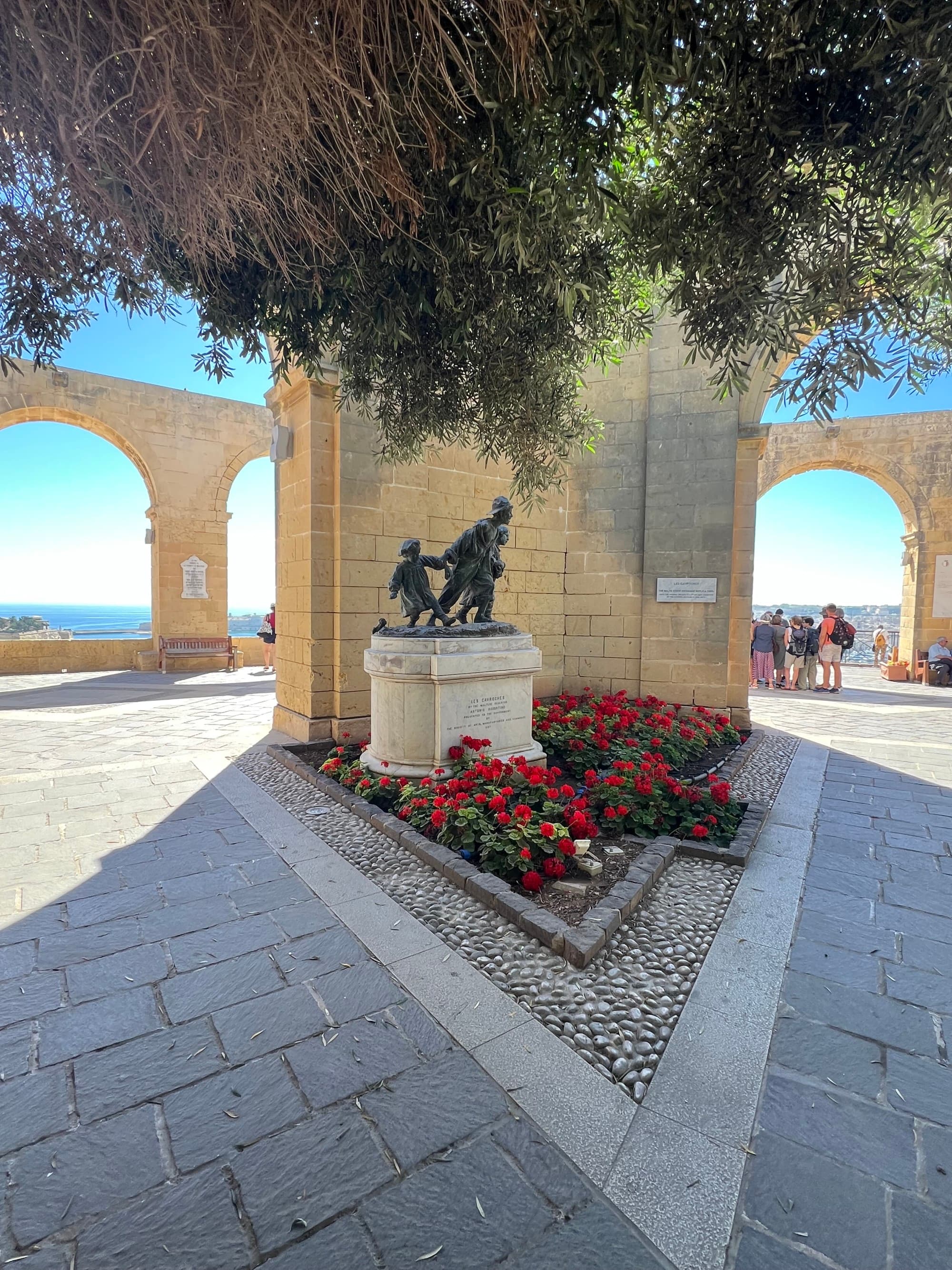 An ancient set of walls surrounding a sculpture.