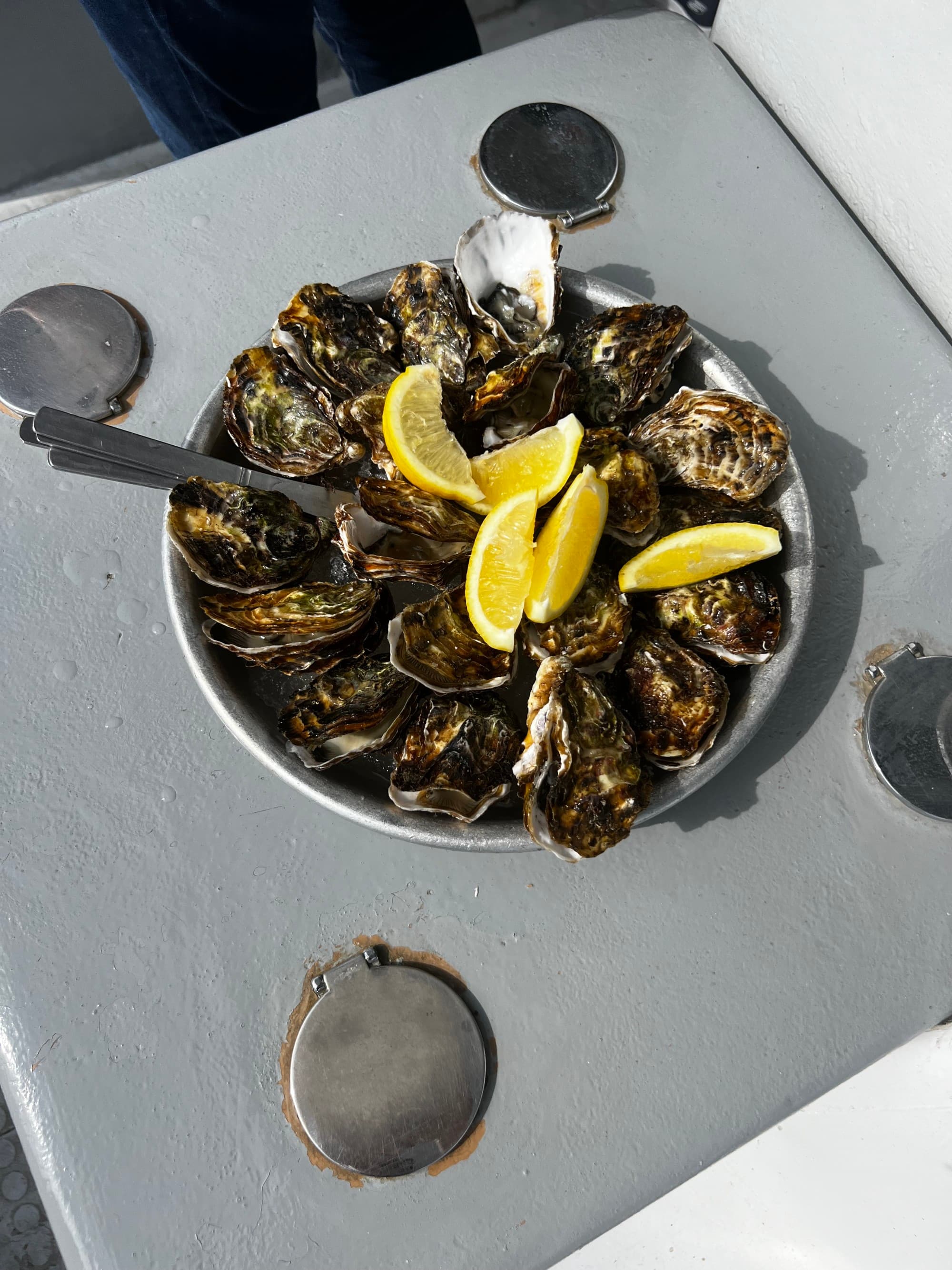 A plate of shellfish on an outdoor table