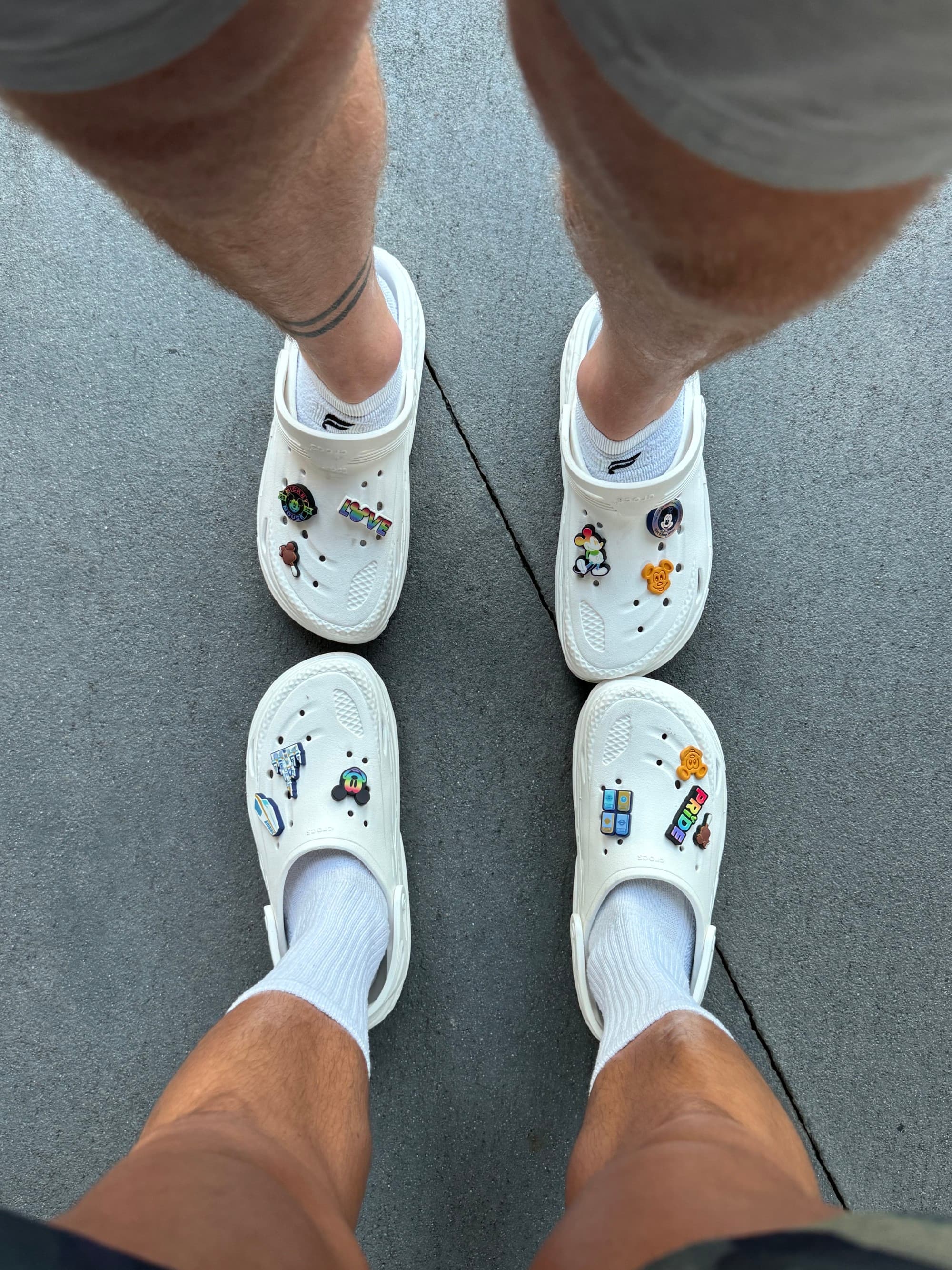 Men feet wearing Crocs