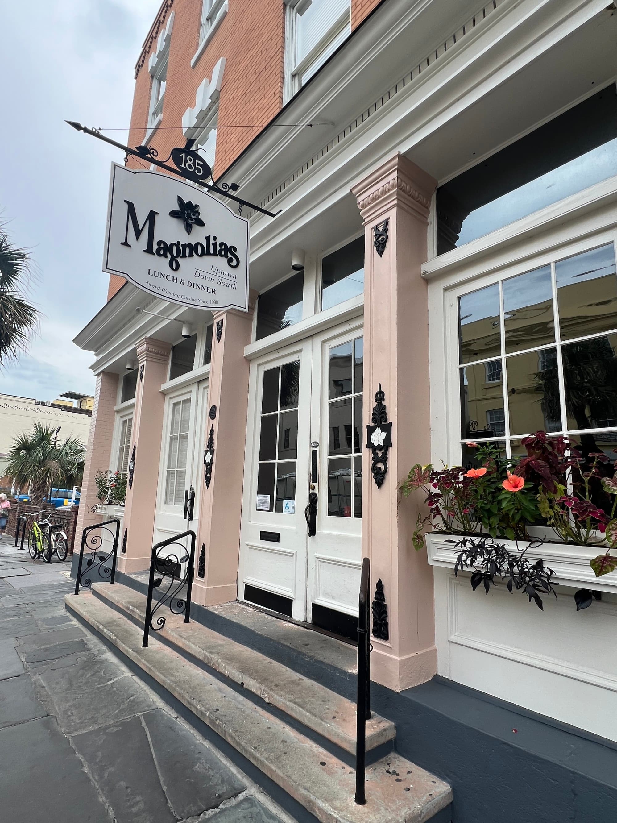The outside of a store building painted pale pink