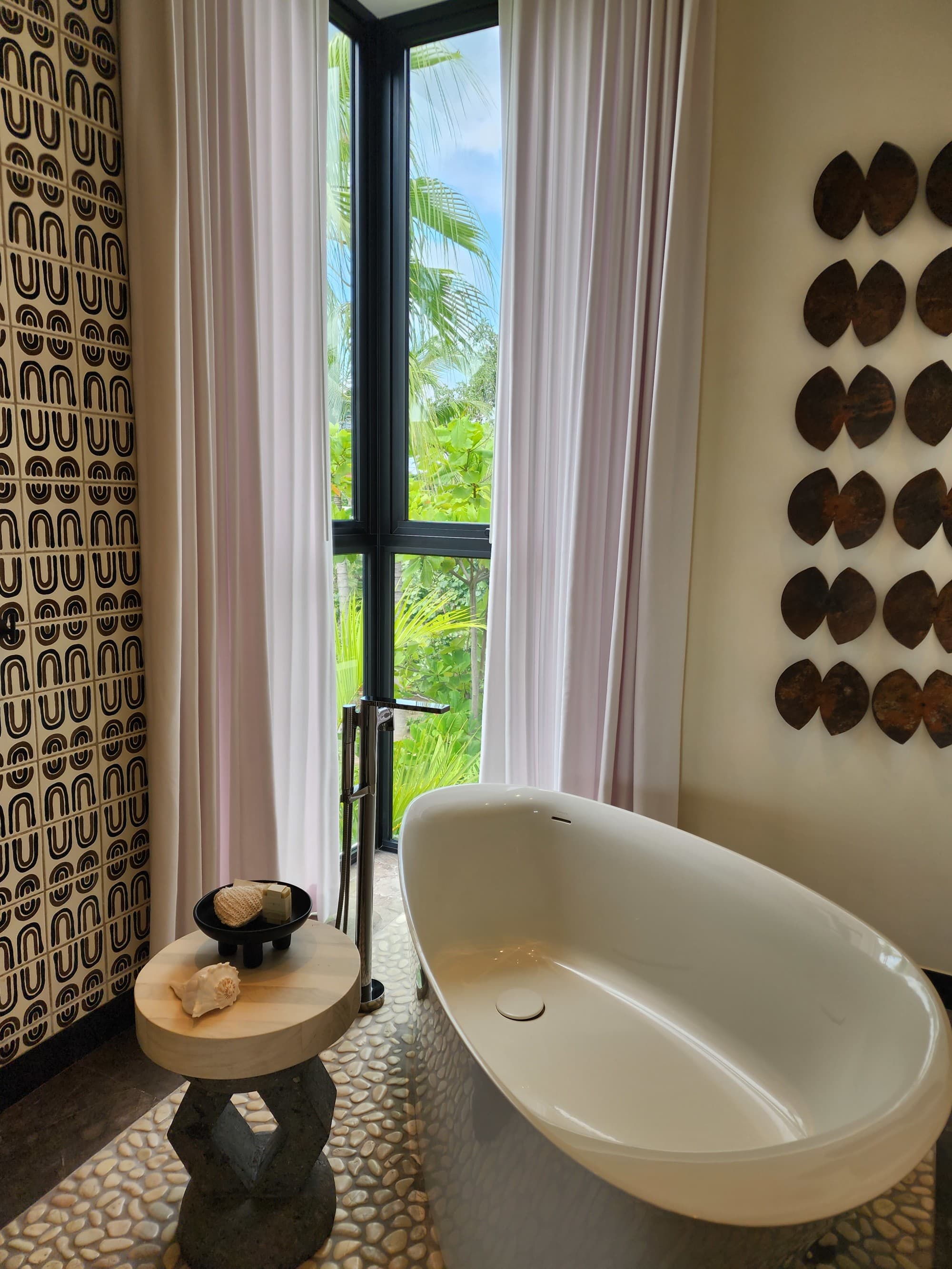 A freestanding bathtub in a bathroom