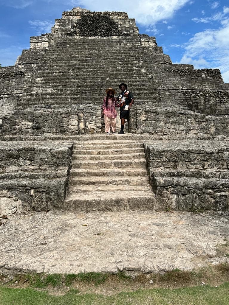 Travel advisor posing in front of ruins of an old building