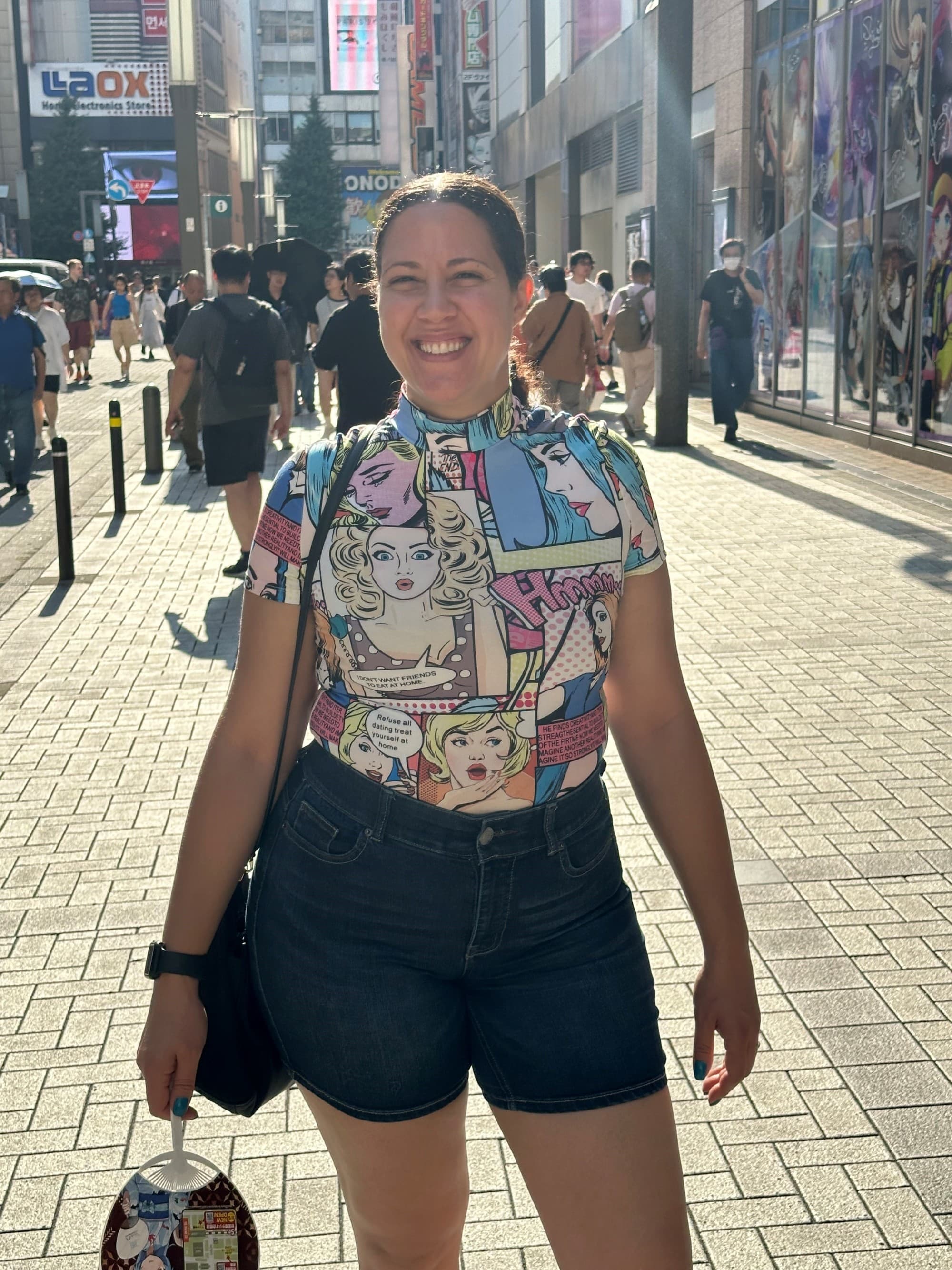 A person standing in a city street during the daytime