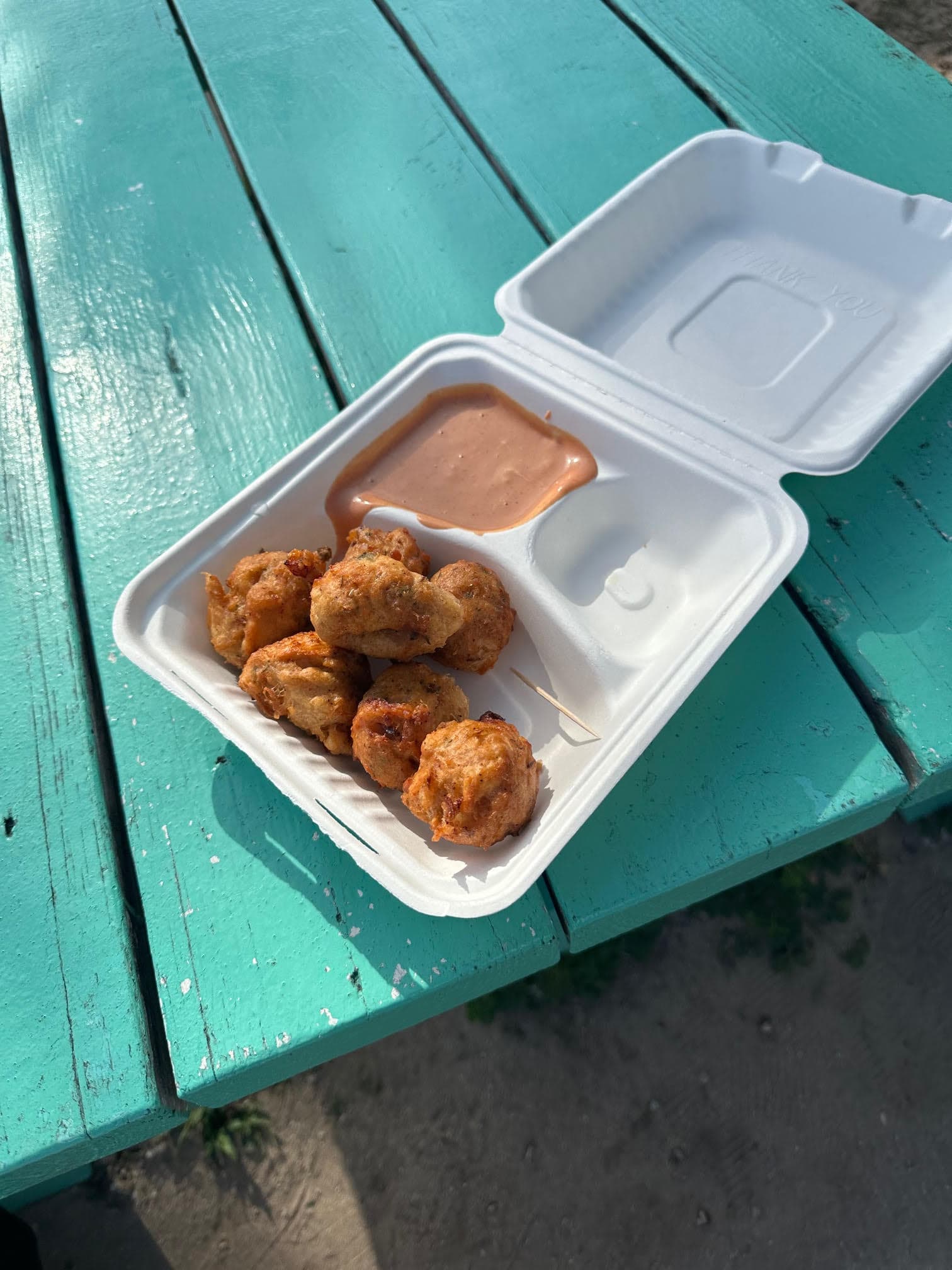 A styrofoam take-out container of food