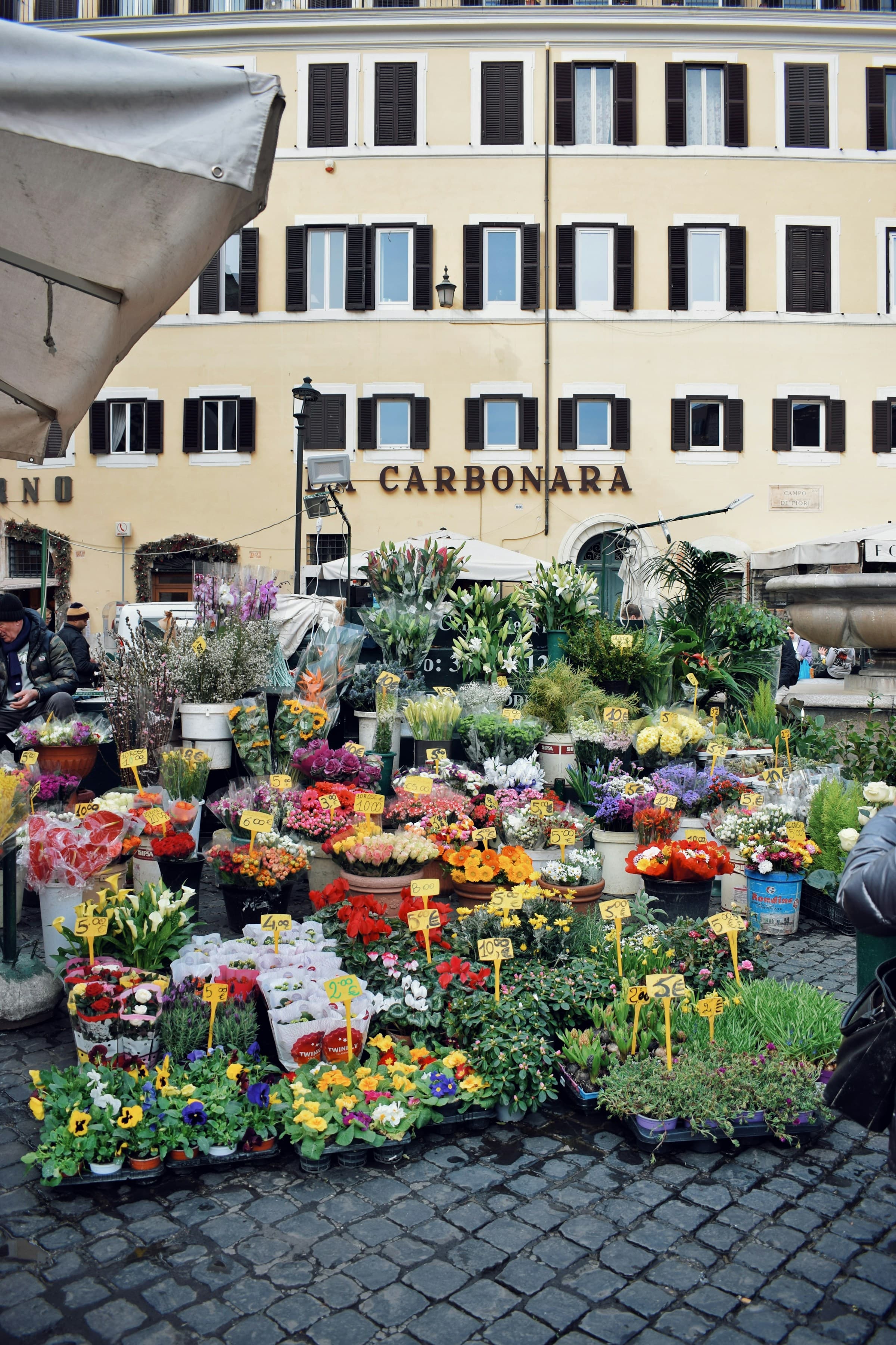 Beautiful flowers outside at Campo de' Fiori, Rome, one of the best markets in Rome.
